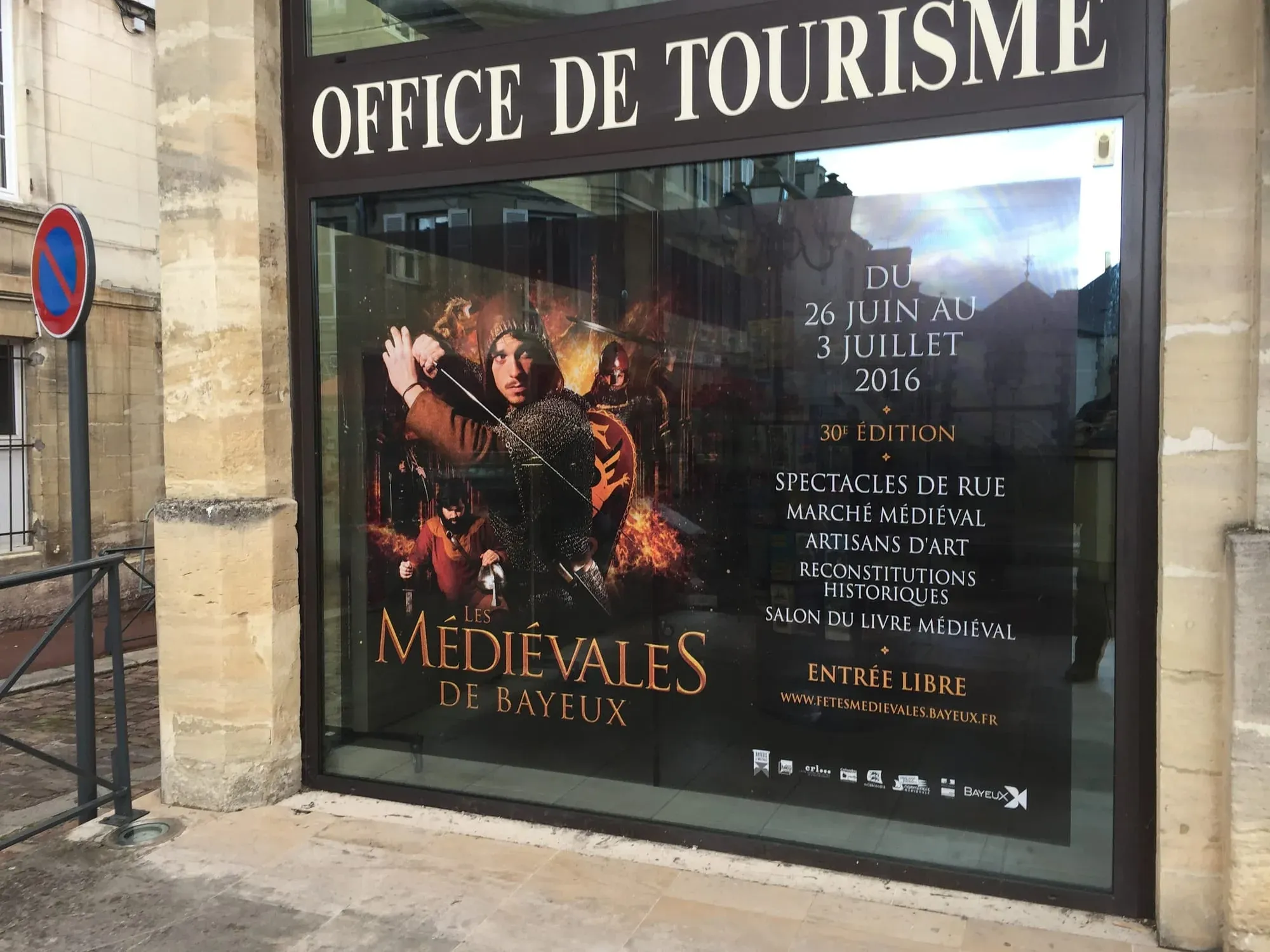 Tourism office window display advertising Les Medievales de Bayeux festival