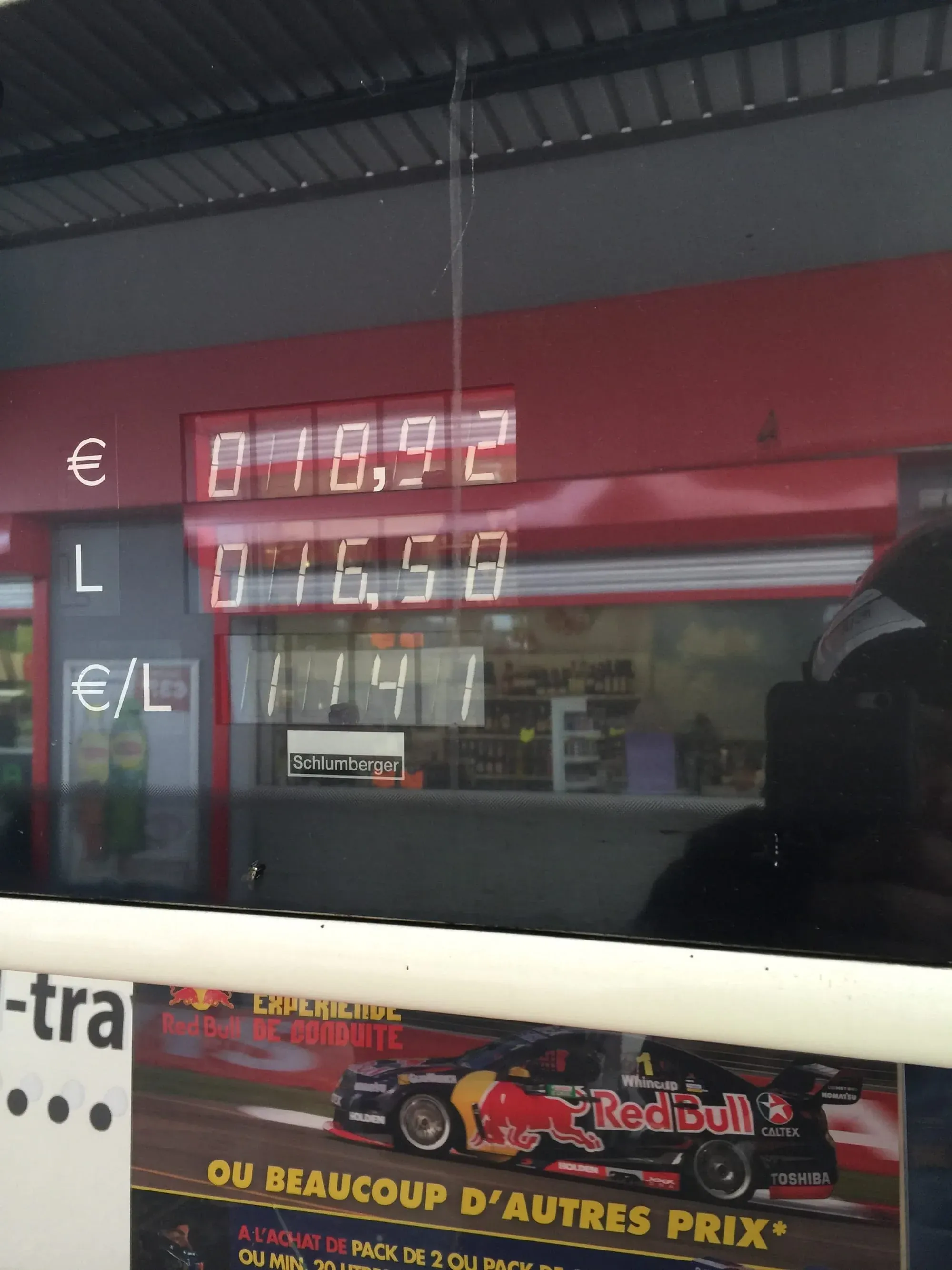 Red fuel pump price display showing €0.178.97 per liter at Schlumberger station