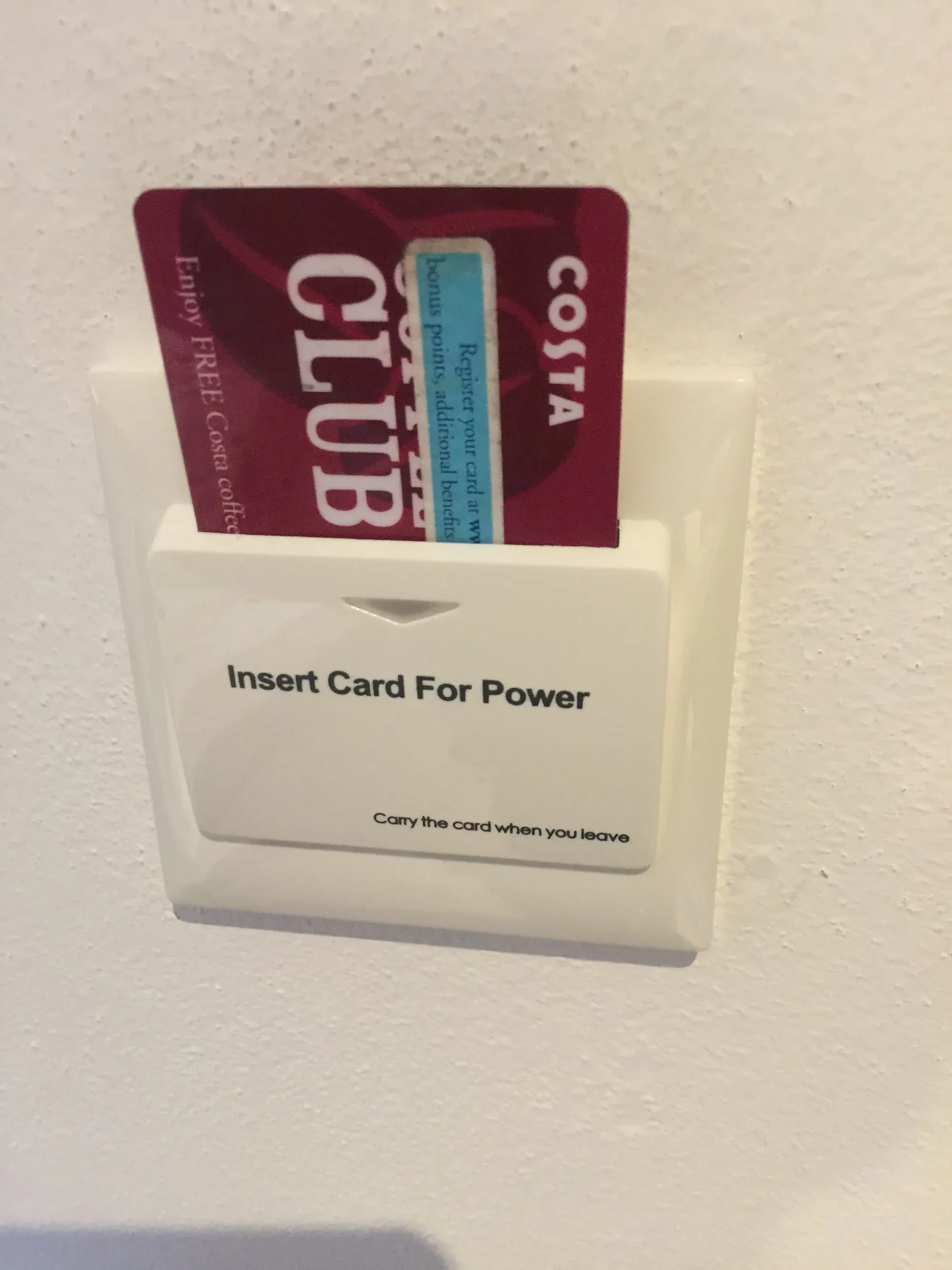 Hotel key card holder with COTA Club card inserted for room power access