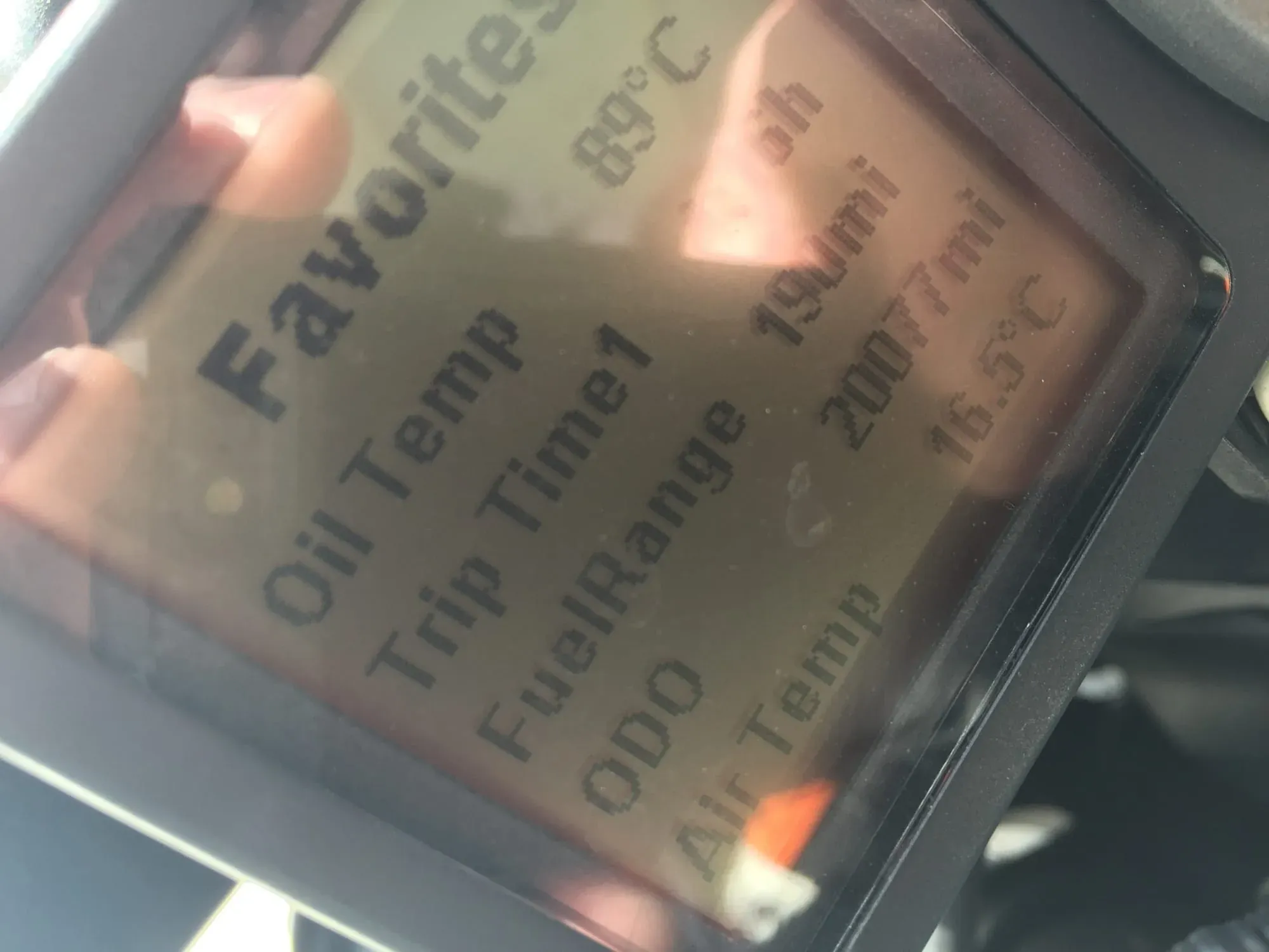 Close-up of product label with text about oil temperature and engine specifications