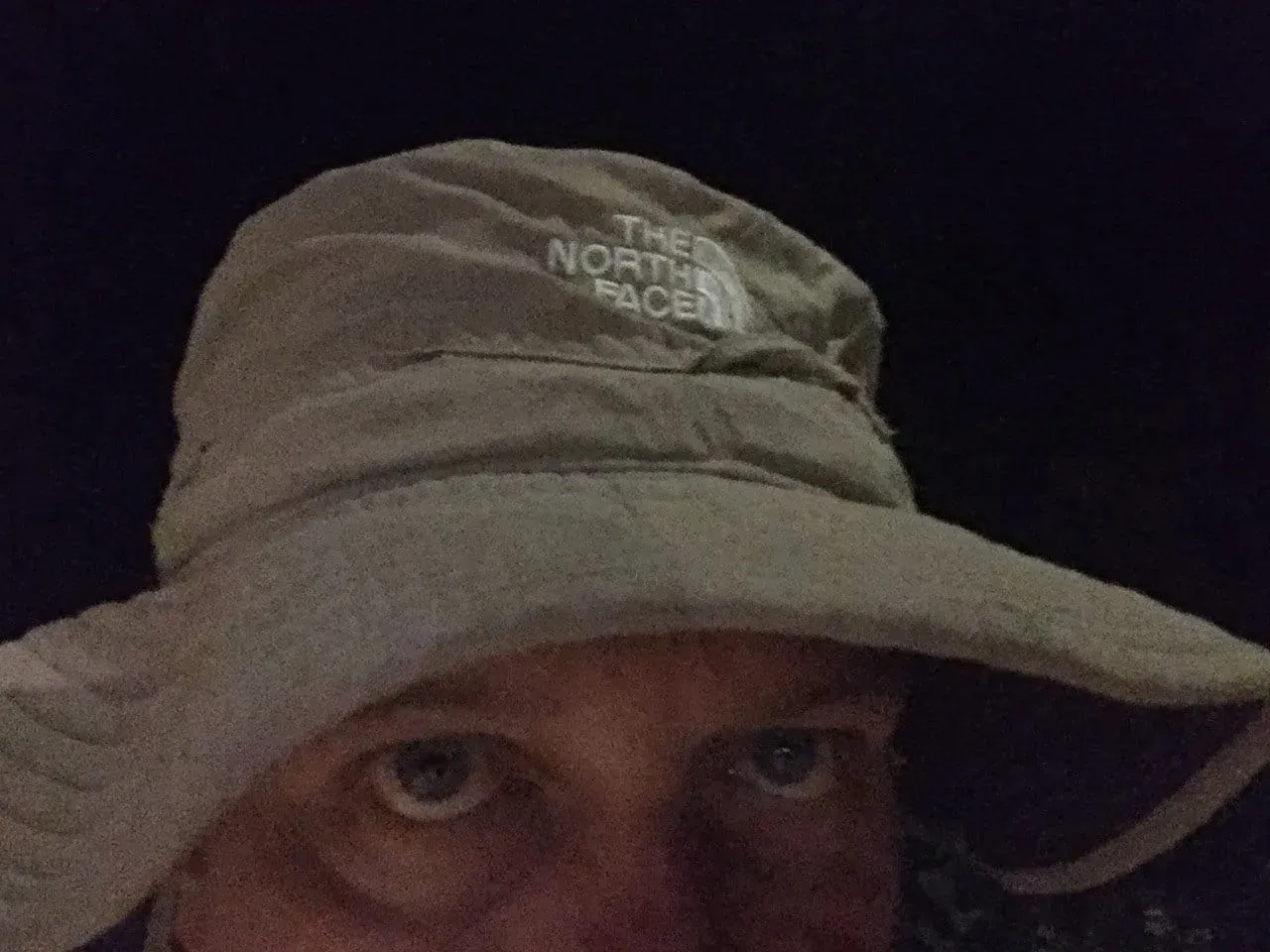 Person wearing The North Face hat and cap, selfie photo