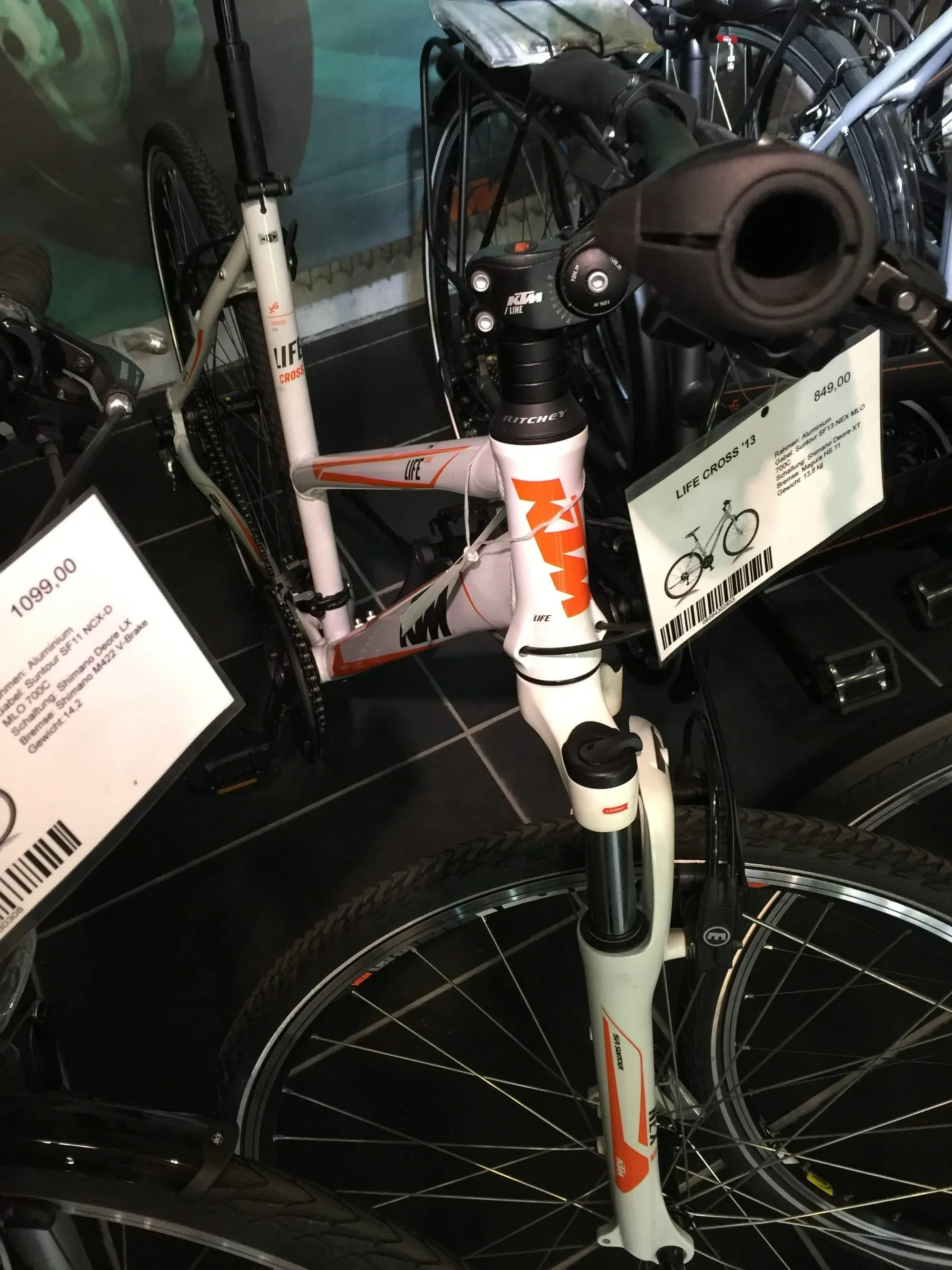 White KTM Life Cross mountain bike on display in shop with €1099.00 price tag