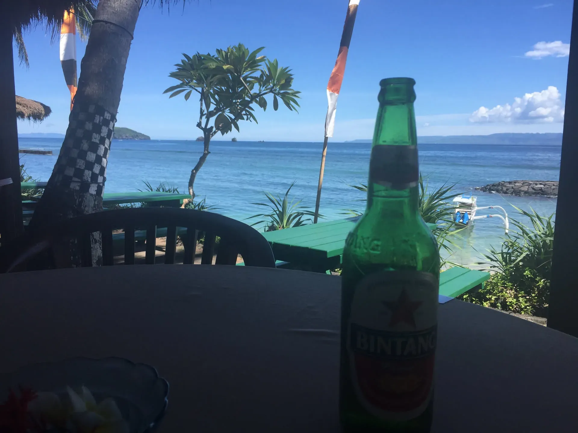 Green beer bottle at beachfront bar, Candi Bali