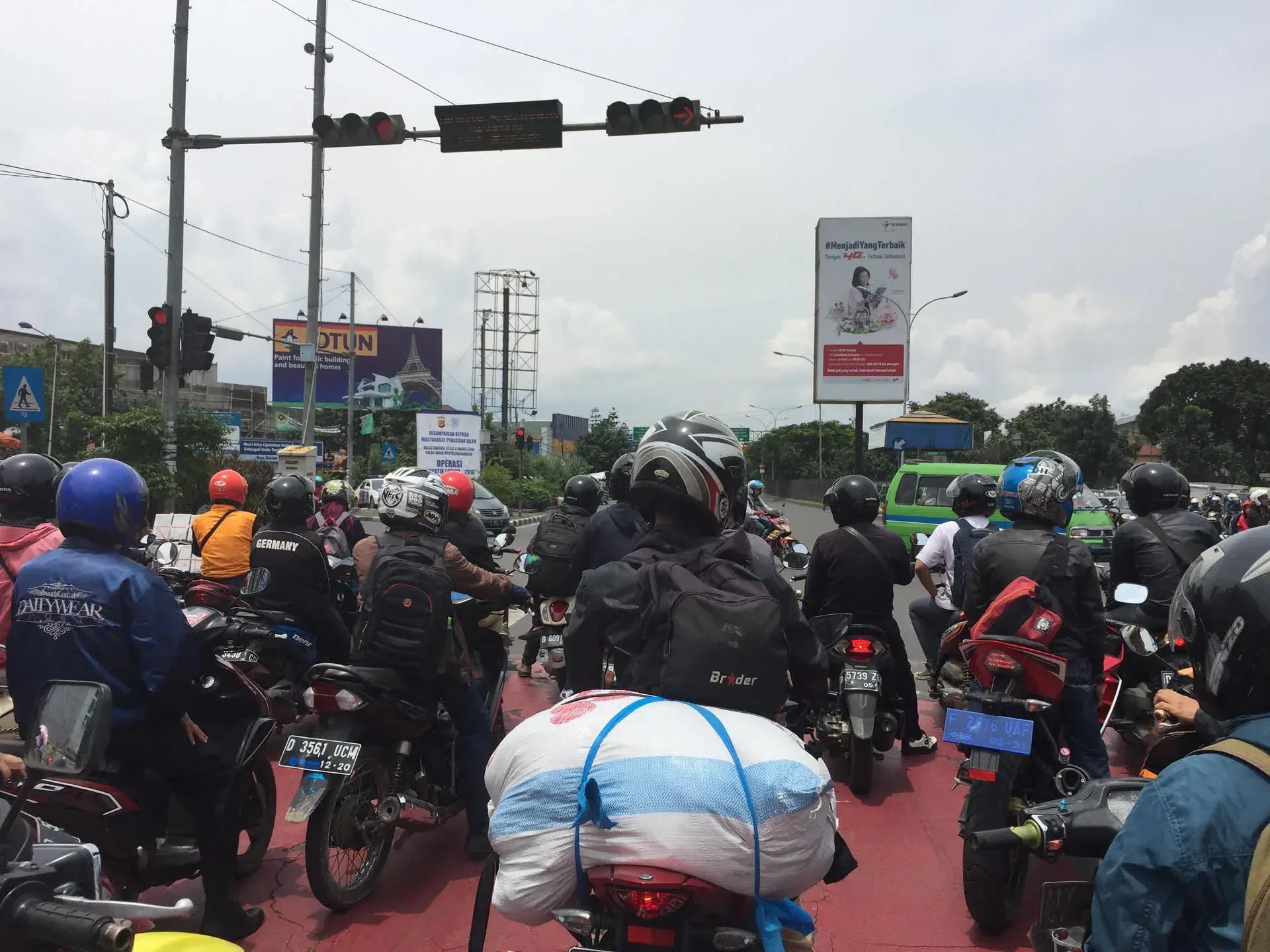 Traffic jam with motorcycles at busy intersection