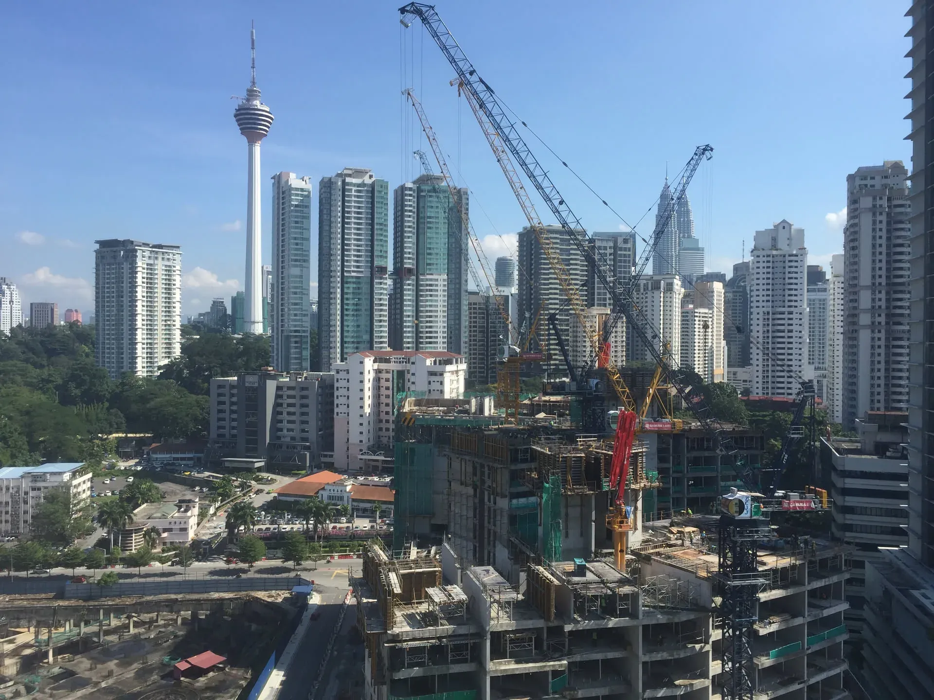 Construction cranes over Bukit Bintang skyline, Kuala Lumpur