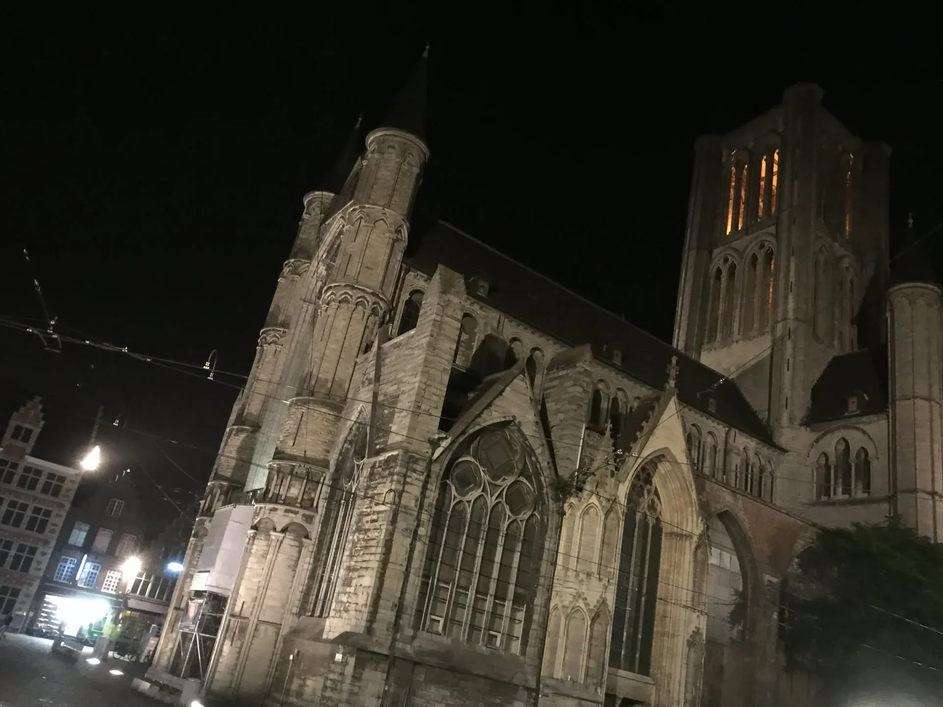 Gothic cathedral illuminated at night in Ghent