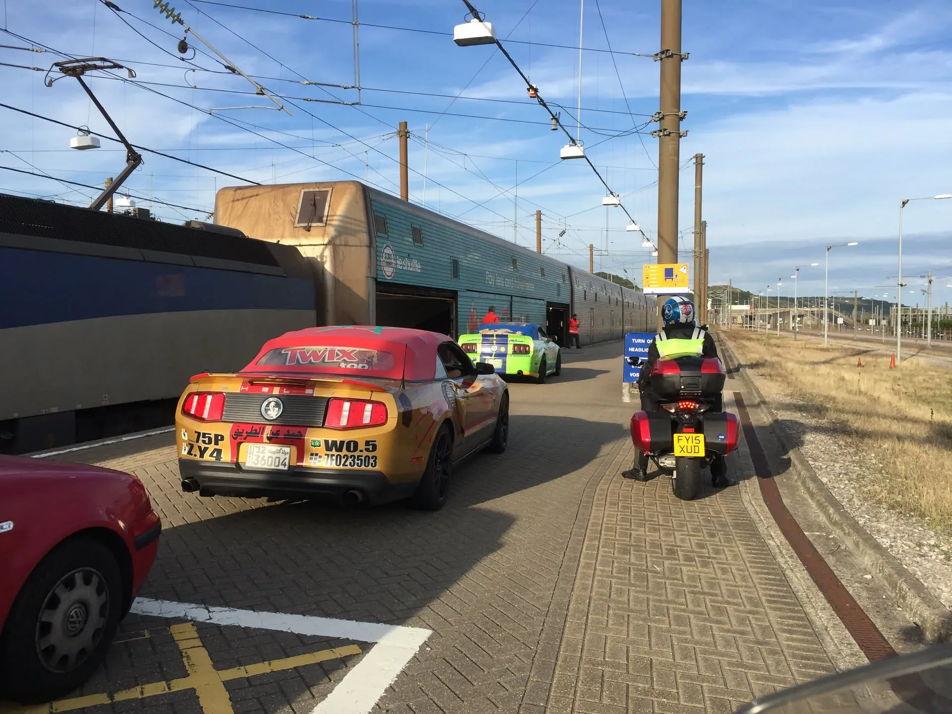 Custom cars lined up at Folkestone station platform