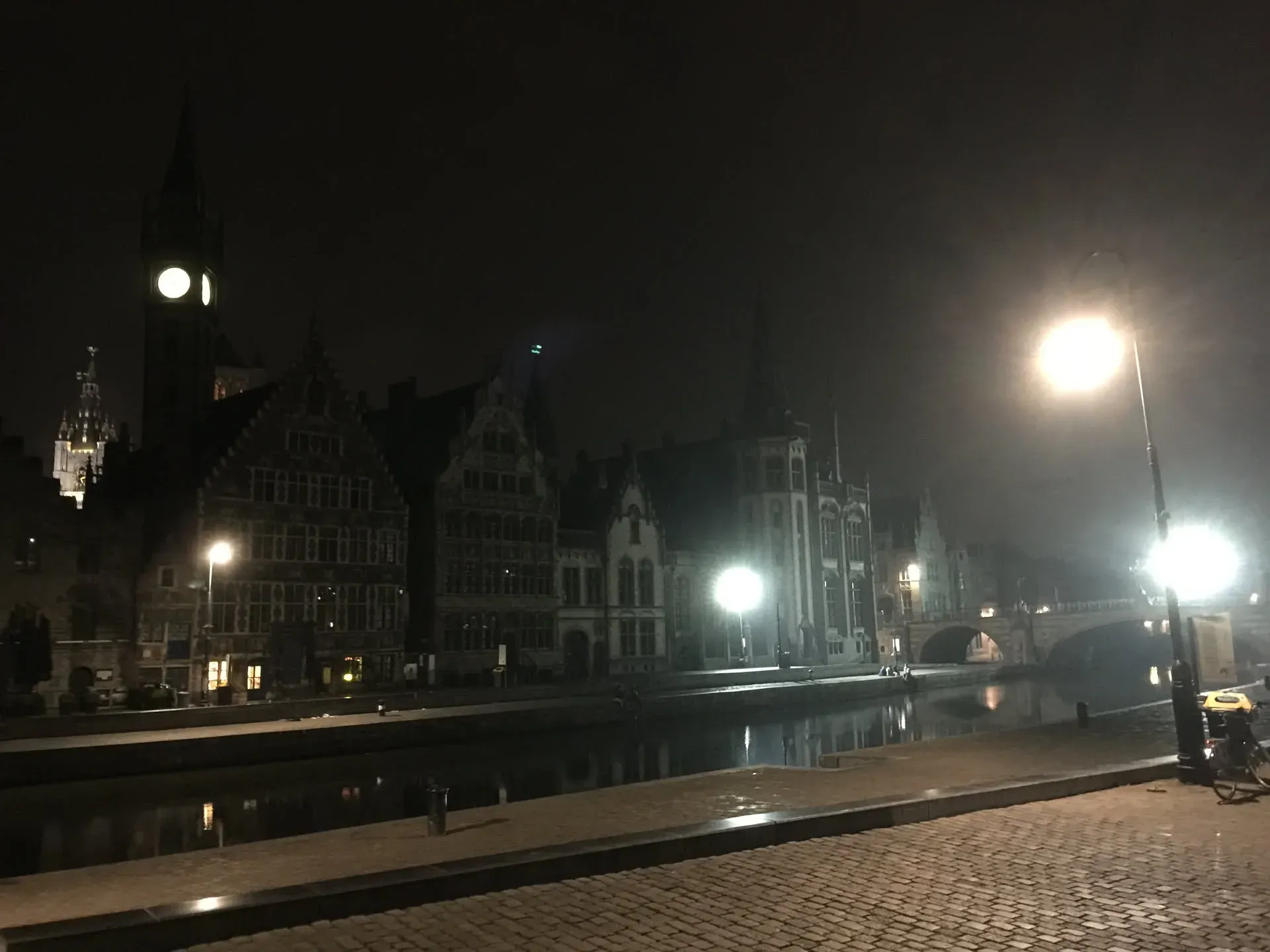 Night view of Ghent's historic waterfront and bridges