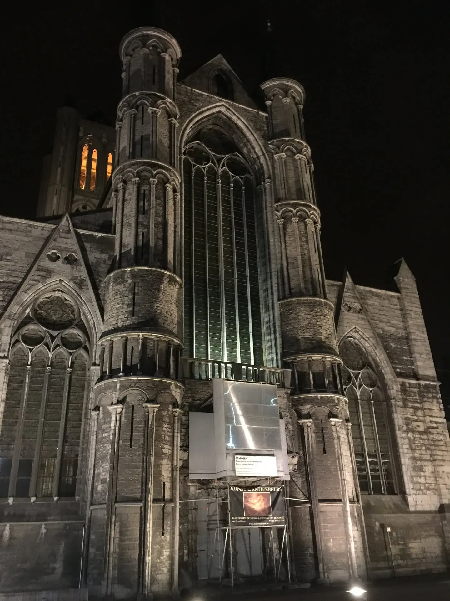 Gothic cathedral illuminated at night in Ghent