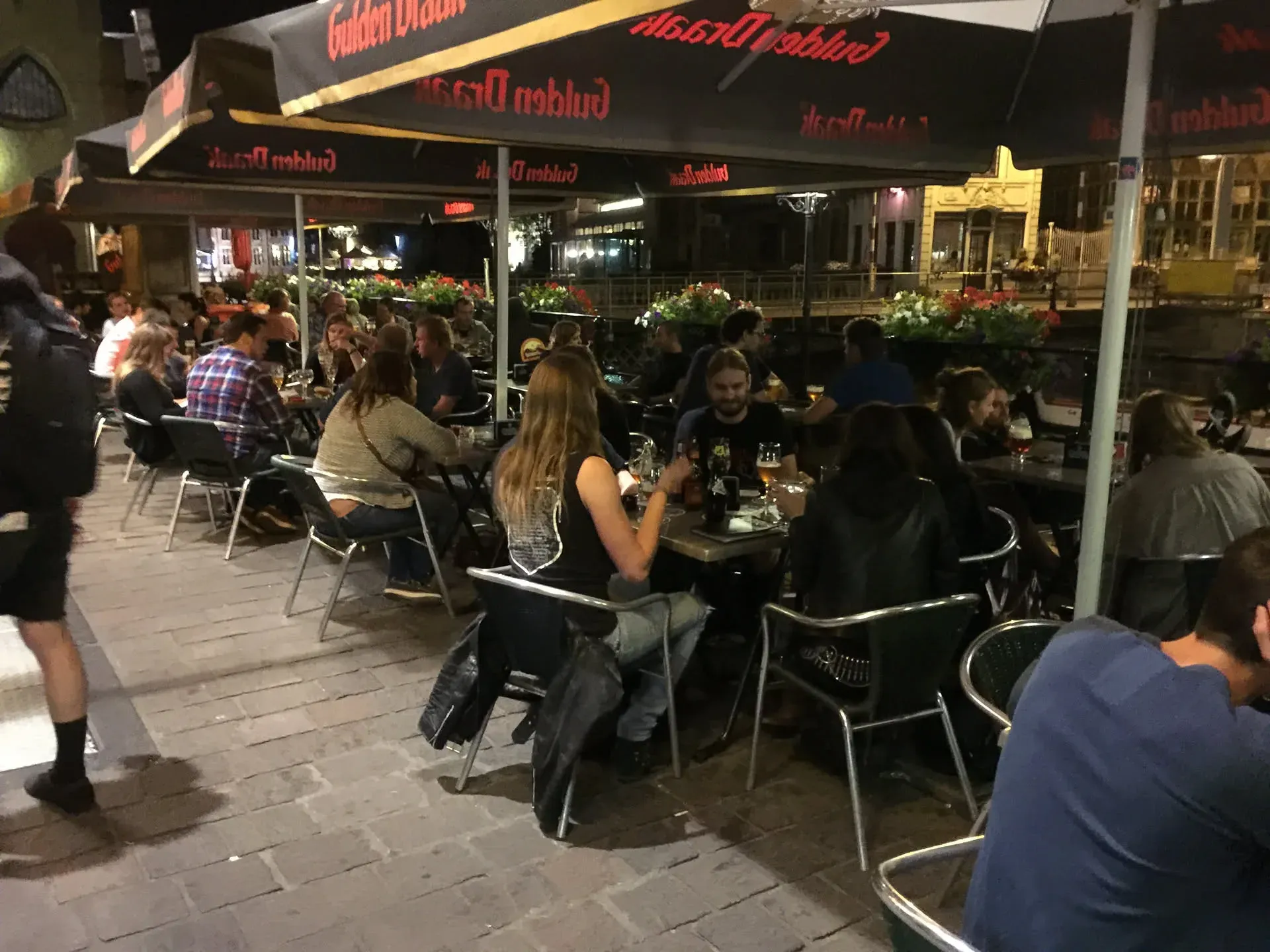 Outdoor restaurant seating at night in Ghent, Belgium