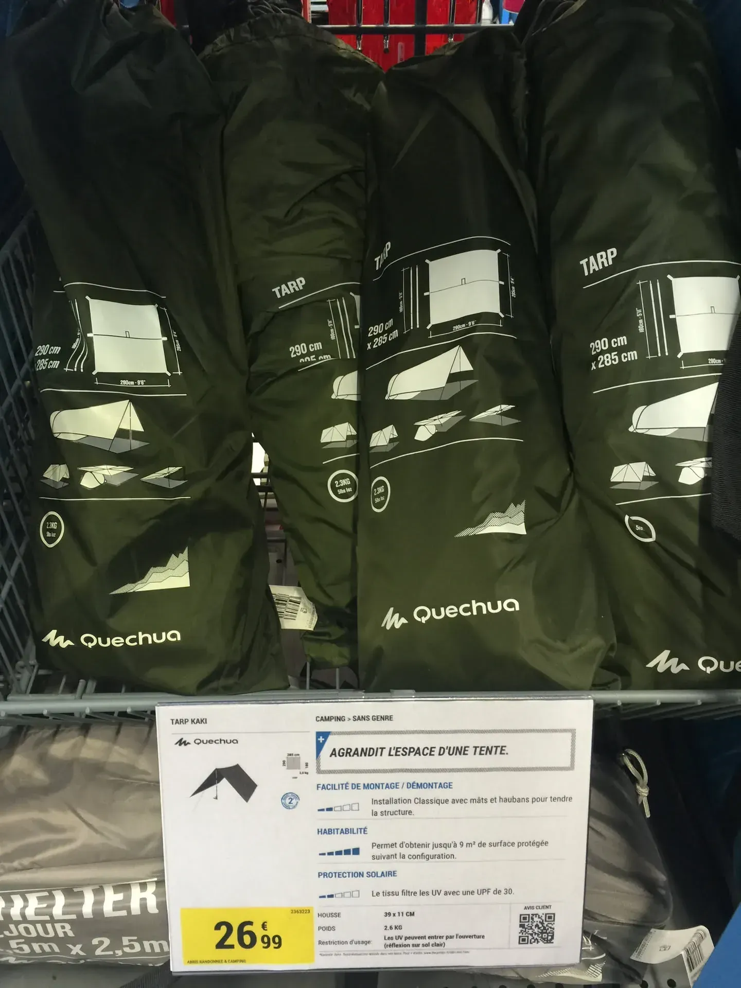 Quechua camping tarps displayed on store shelf