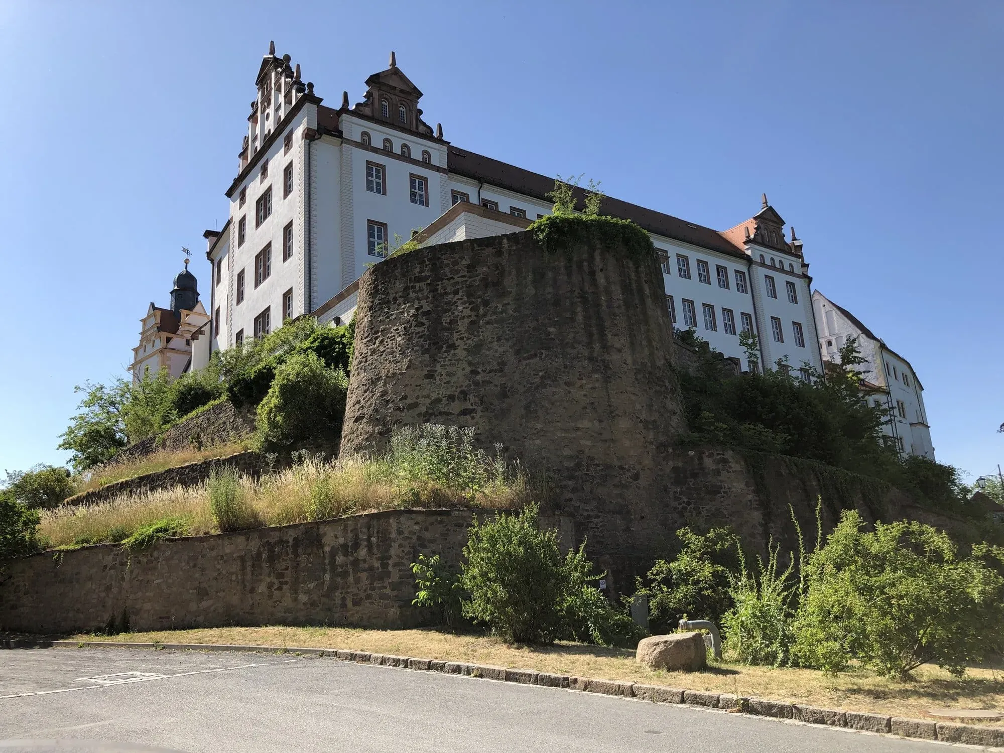 Historic castle perched on hilltop with defensive stone walls