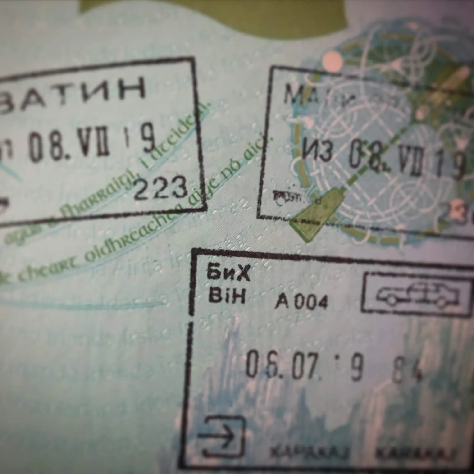 Close-up of Ukrainian passport pages showing visa stamps and map details