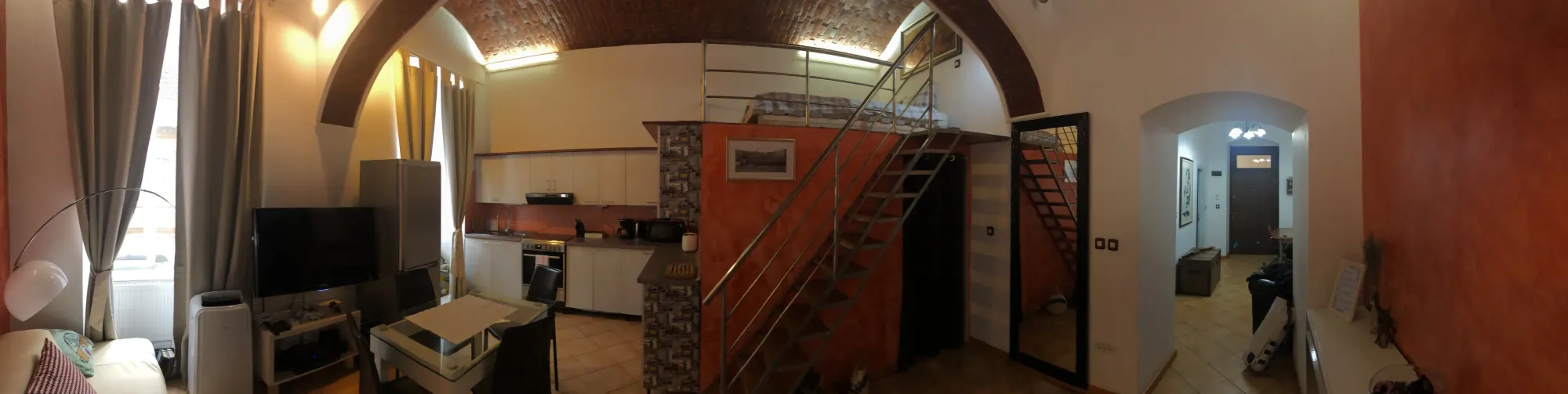 Panoramic interior of converted loft apartment in Cetate, Romania