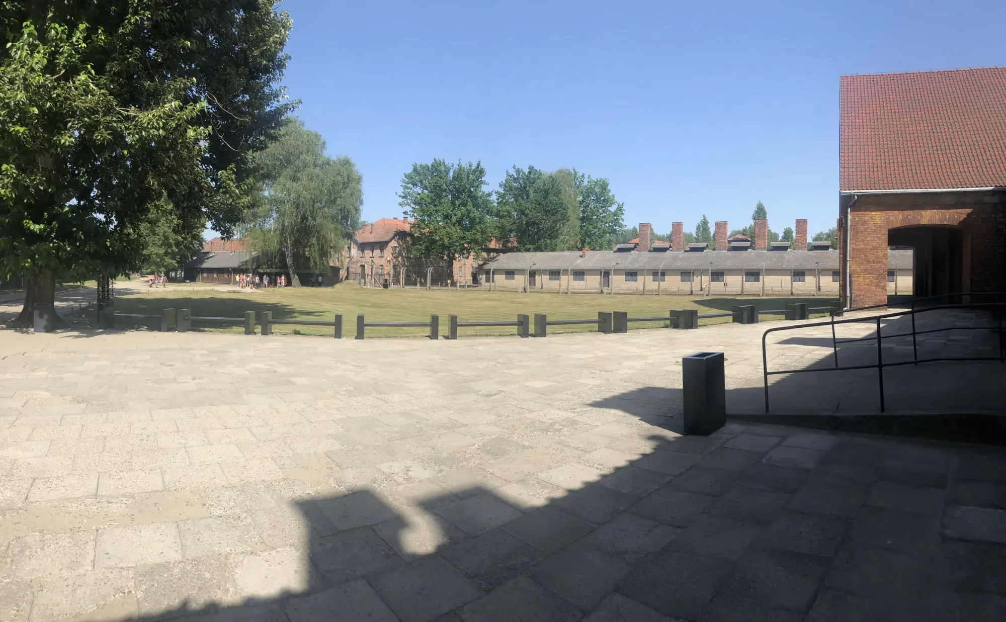 Barbed wire fence and brick barracks at Auschwitz, Stare Stawy