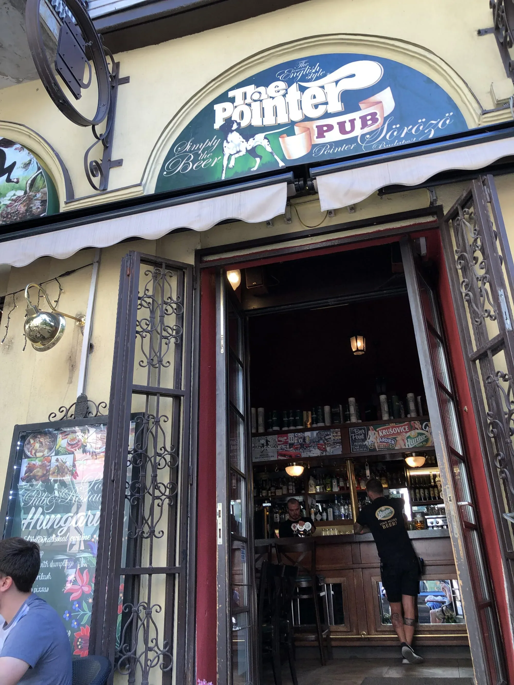 Pointer Pub storefront entrance with ornate door and blue signage