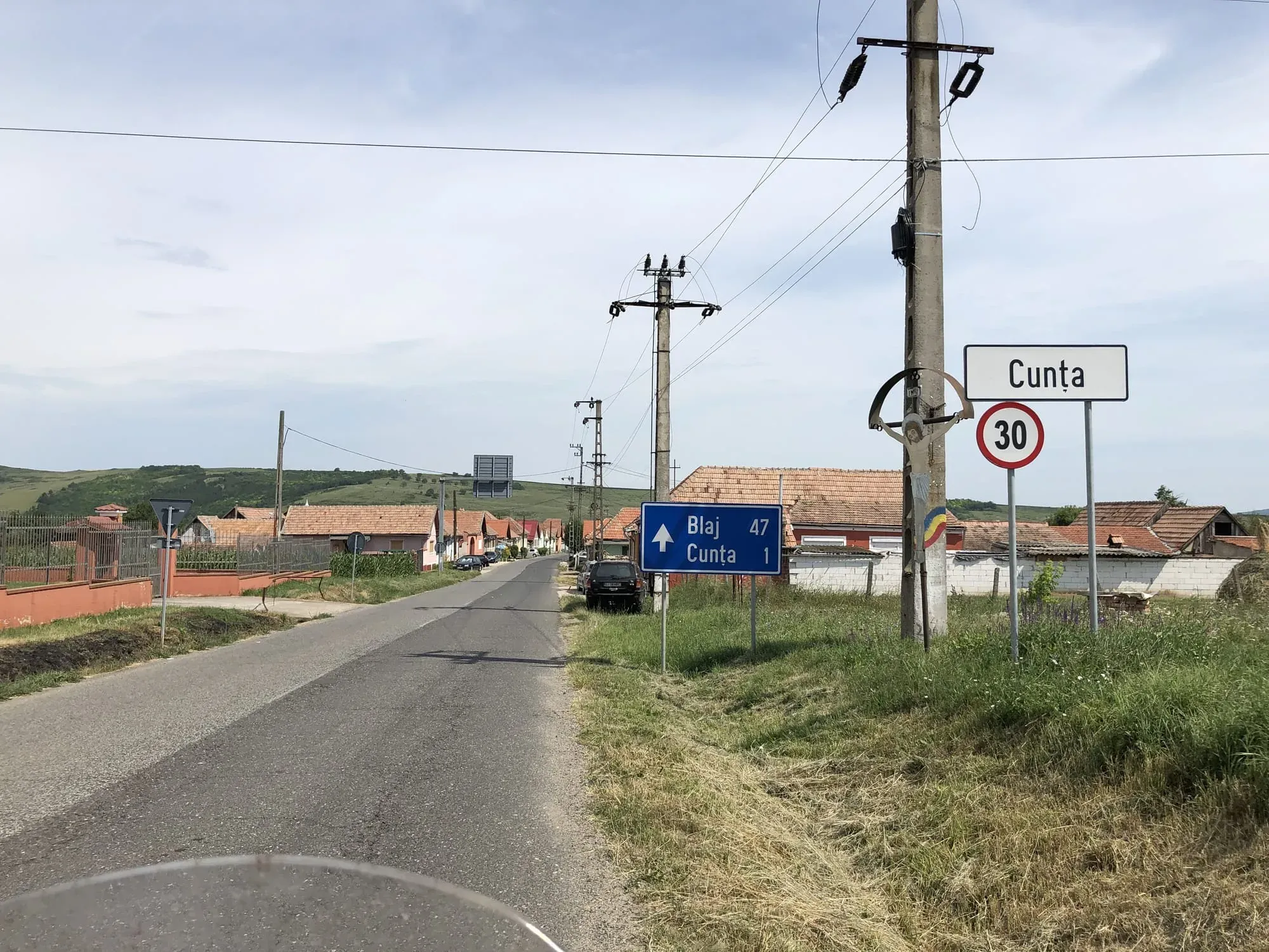 Road sign for Cunta village with 30 km/h speed limit in rural Transylvania area