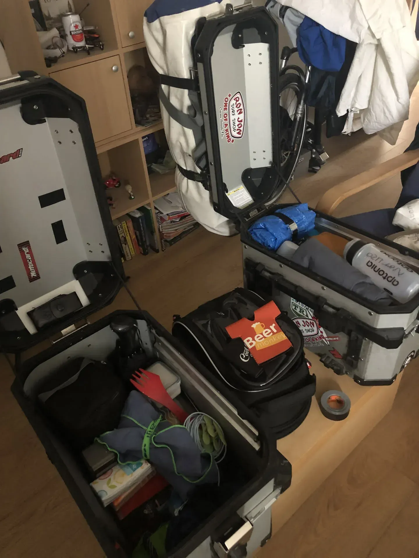 Packed luggage and motorcycle gear in Surbiton bedroom