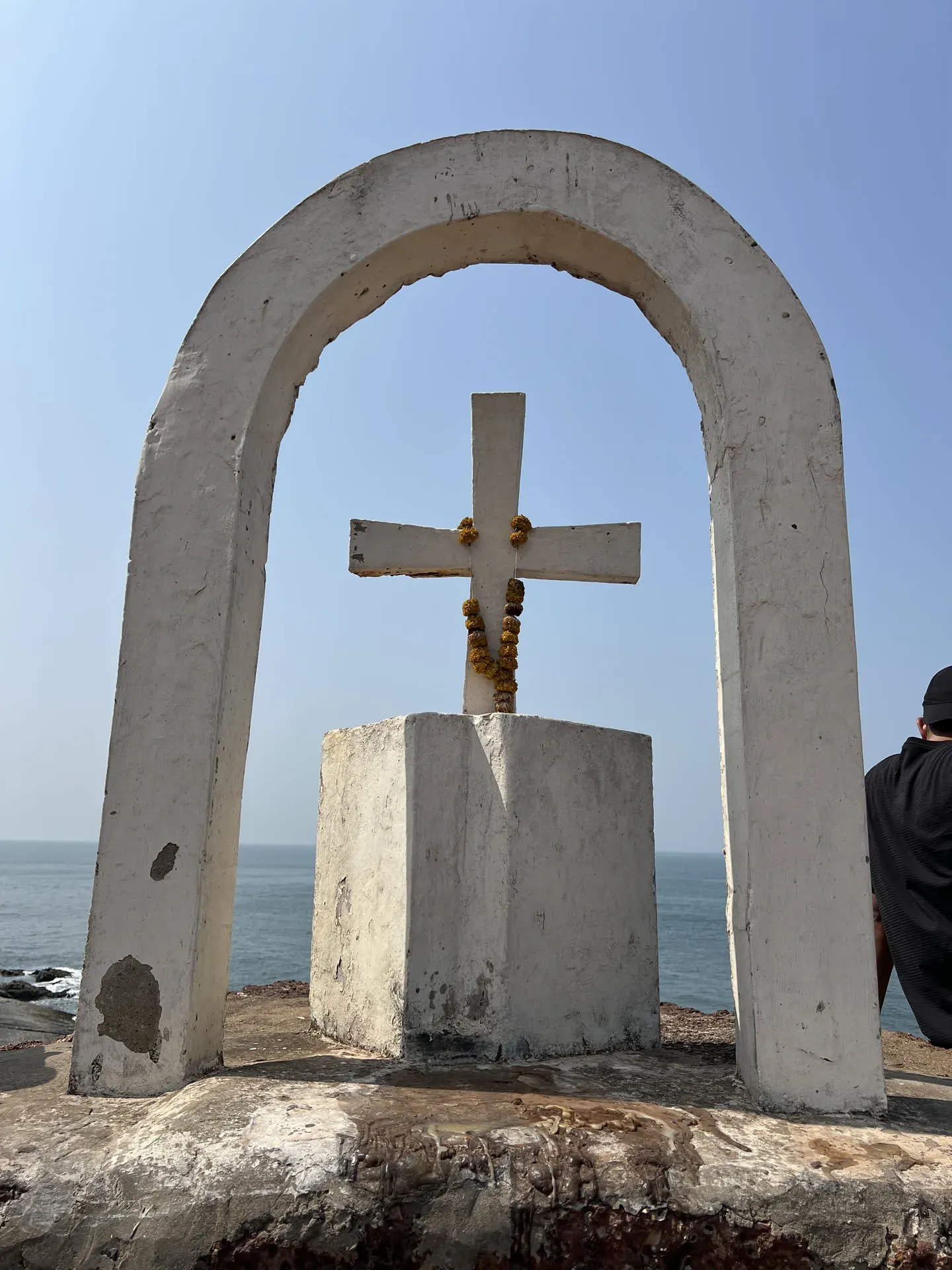 Concrete cross and arch at Marquis Vaddo beach