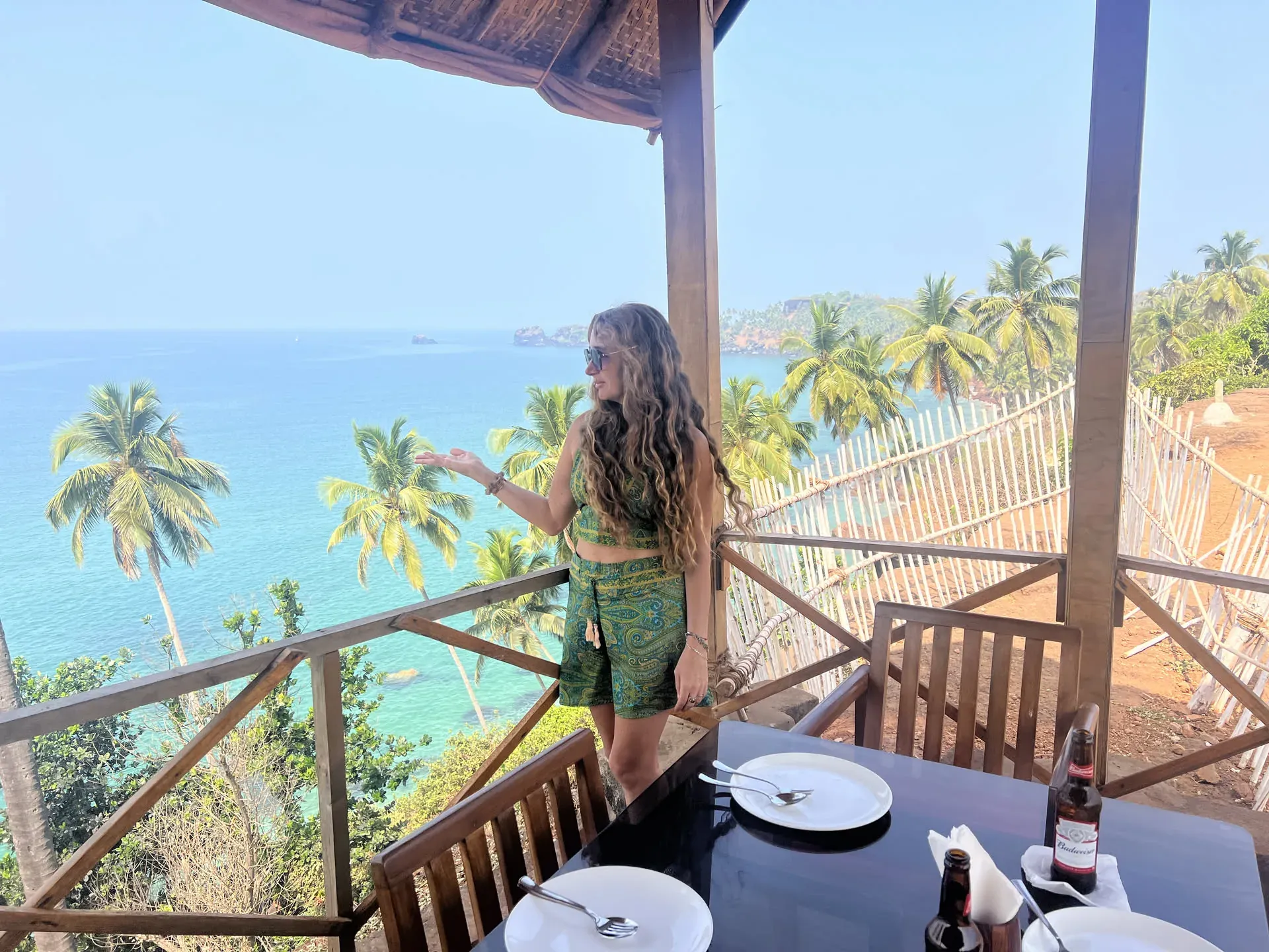 Woman at clifftop restaurant in Kuddi, Goa