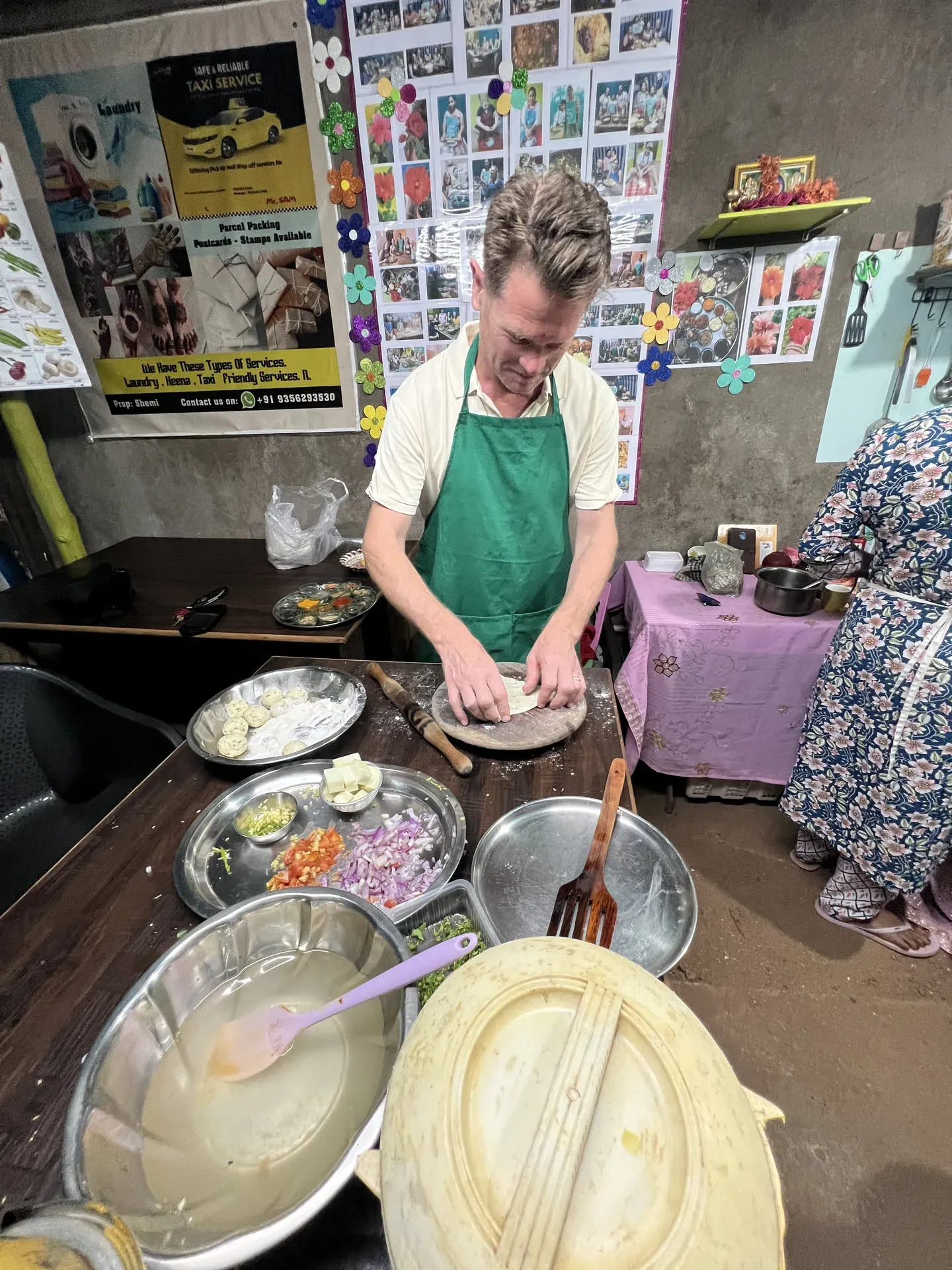 Man preparing dosa at cooking class in Agonda