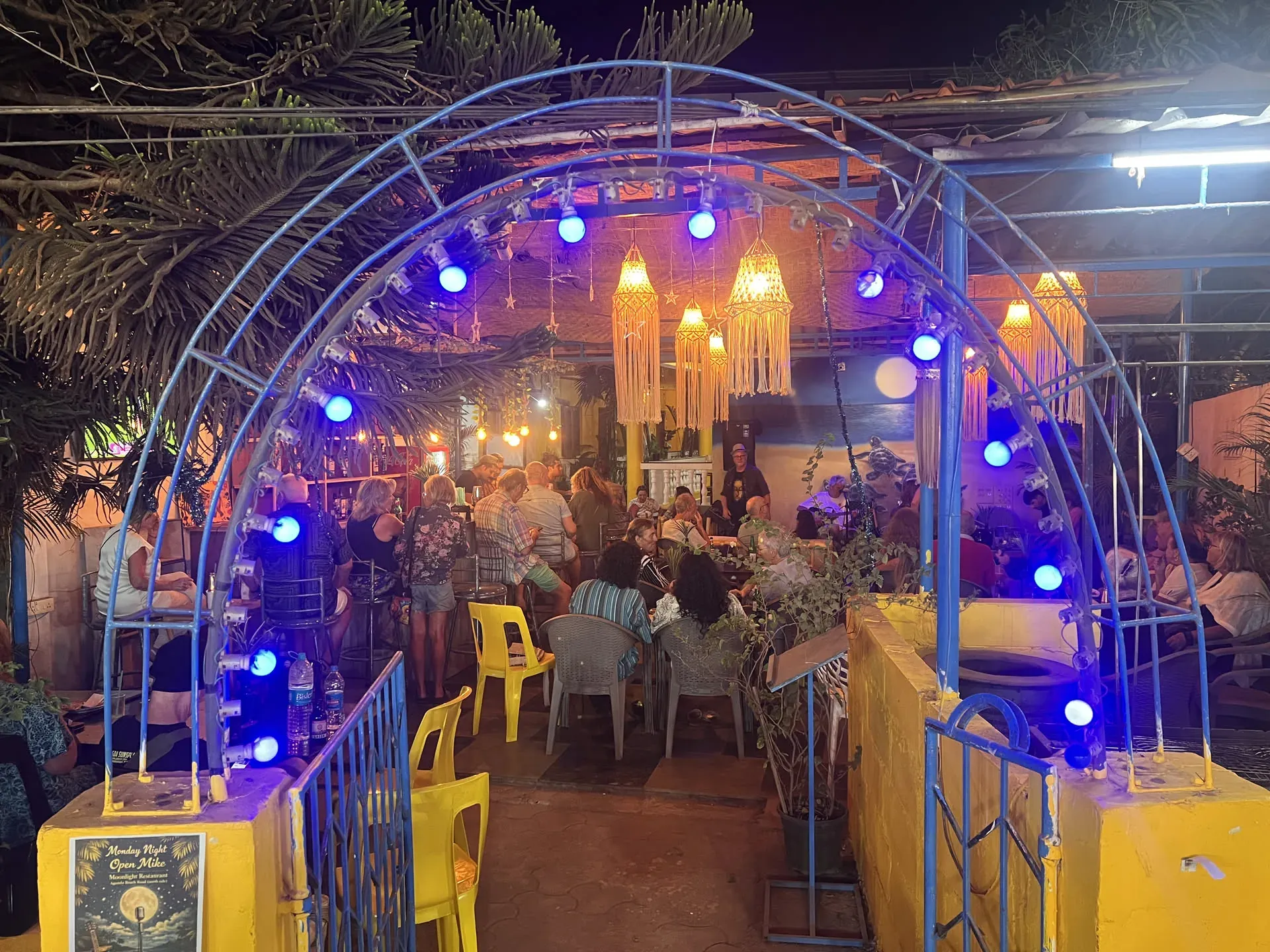Blue-lit arch at beachside event in Agonda