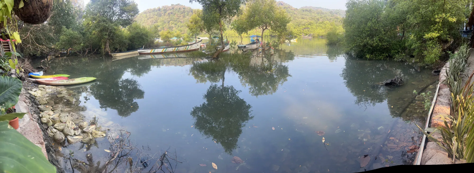 Kayaks and boats moored at Devabag backwater