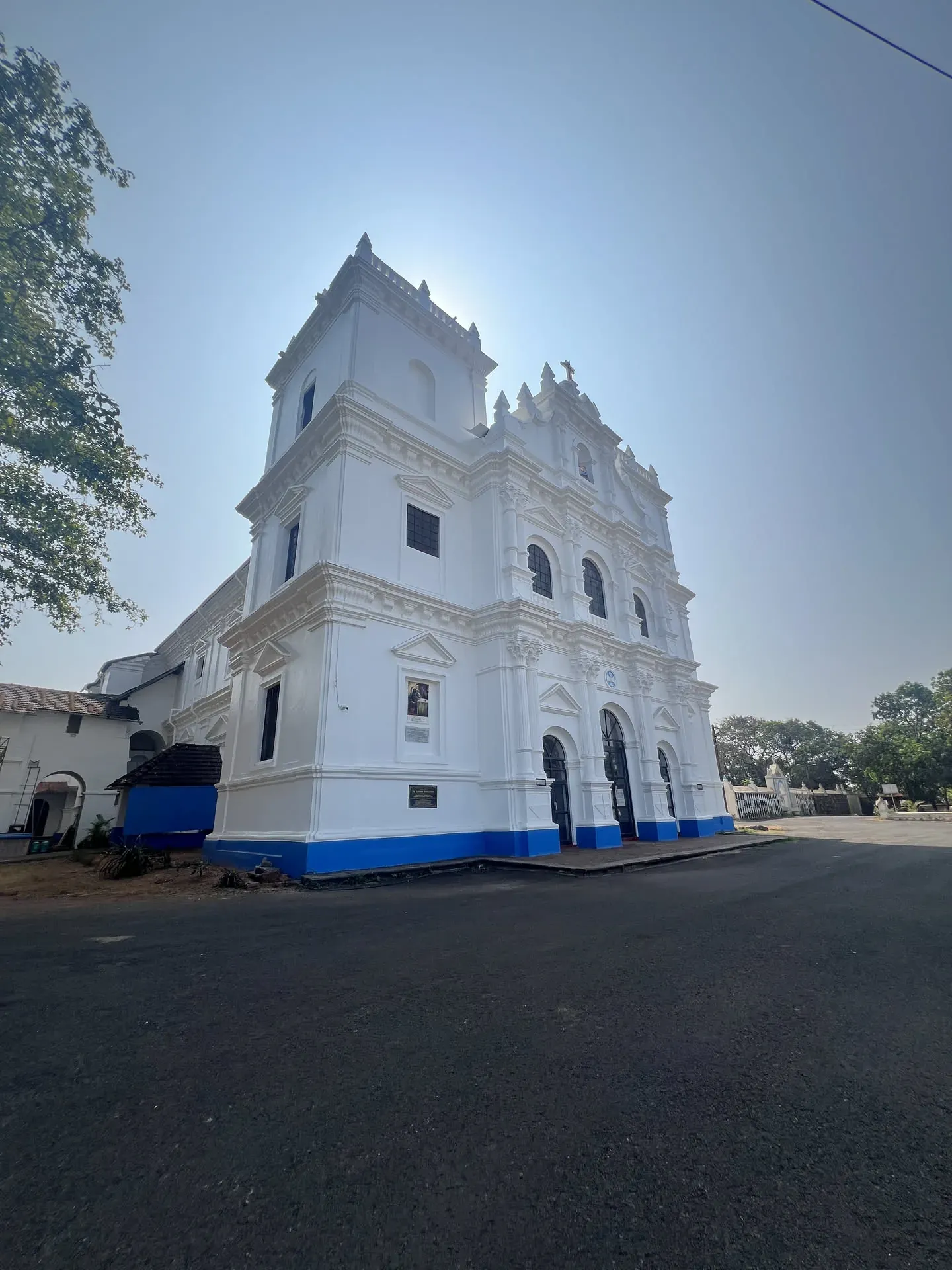 White church with blue base in Navelim