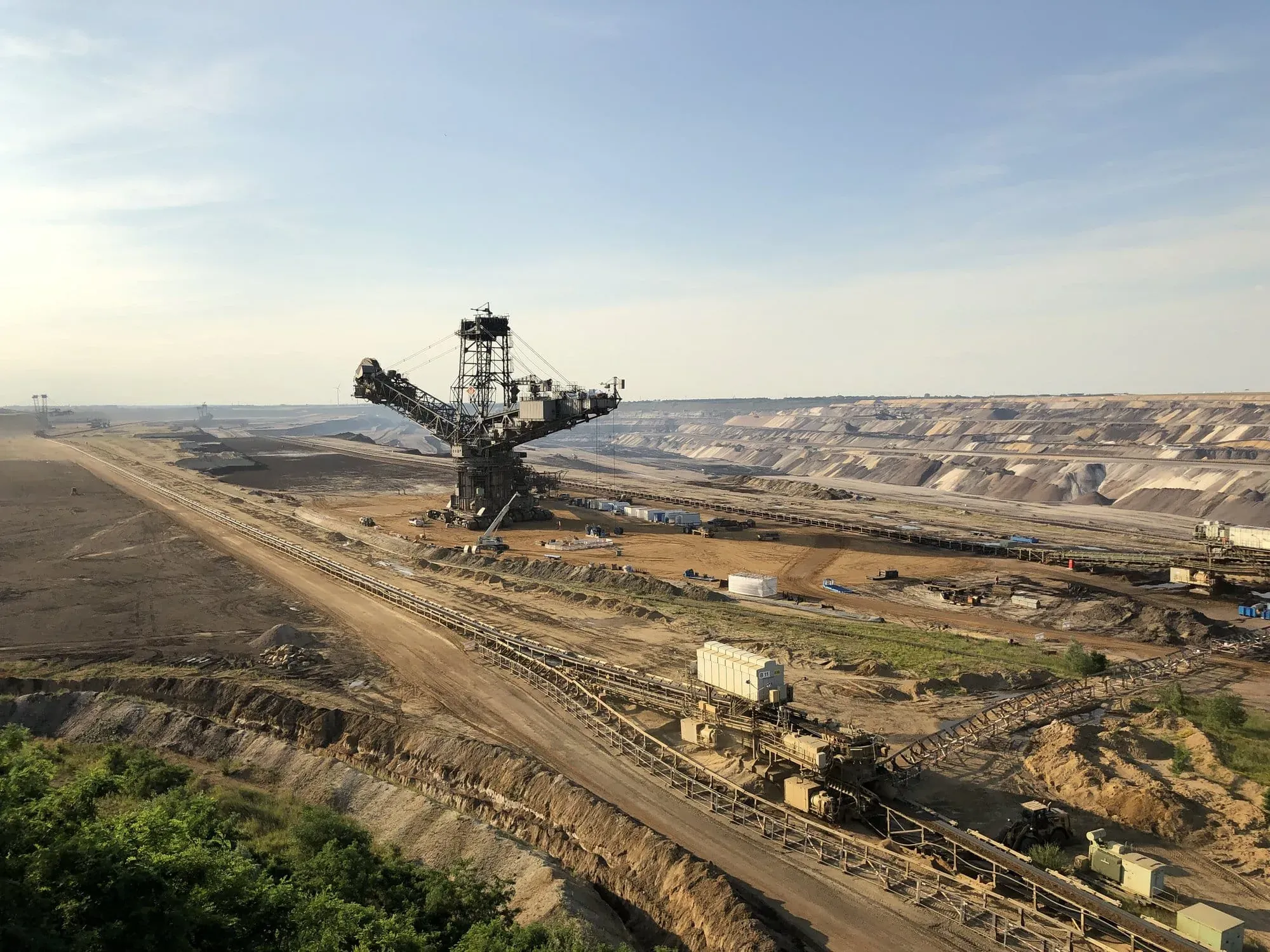 Large bucket-wheel excavator in open-pit coal mine landscape