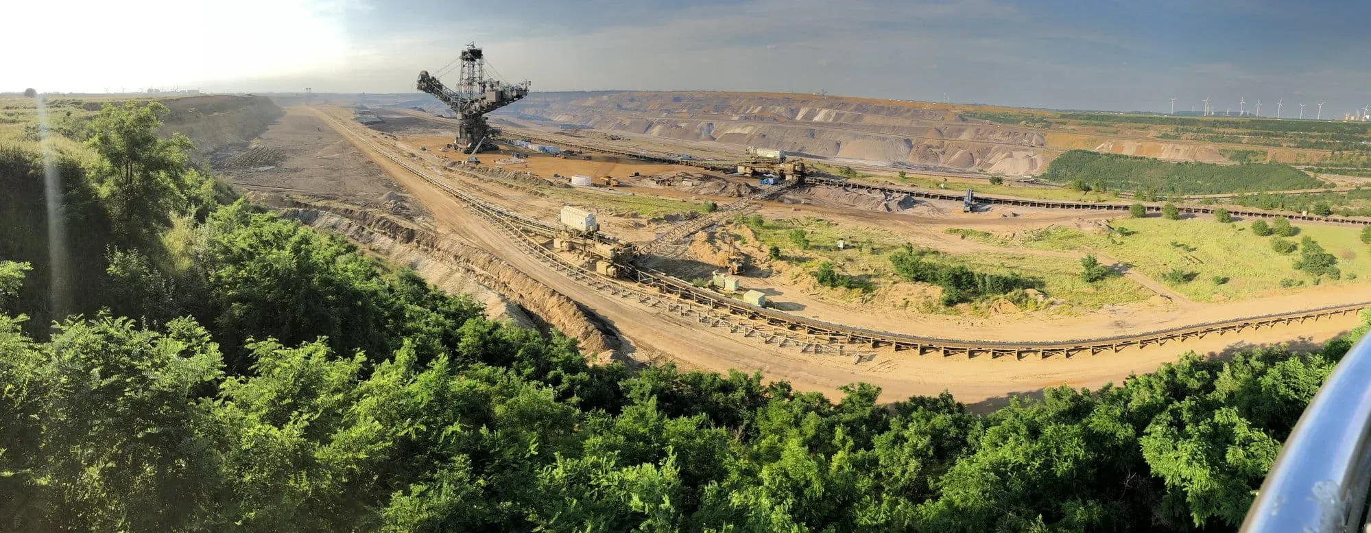 Large-scale open pit coal mining operation with excavator machinery