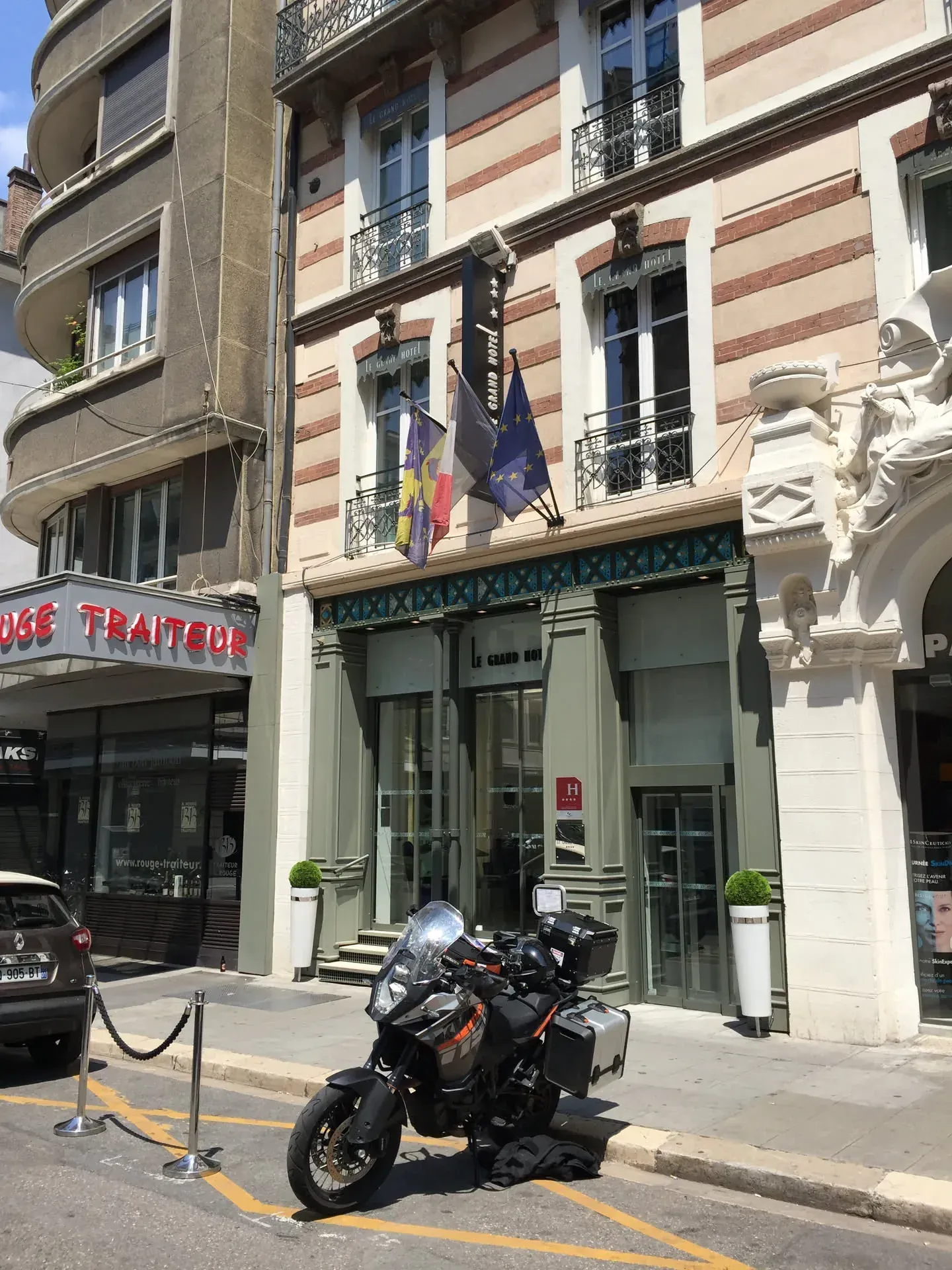Black motorcycle parked in Grenoble street