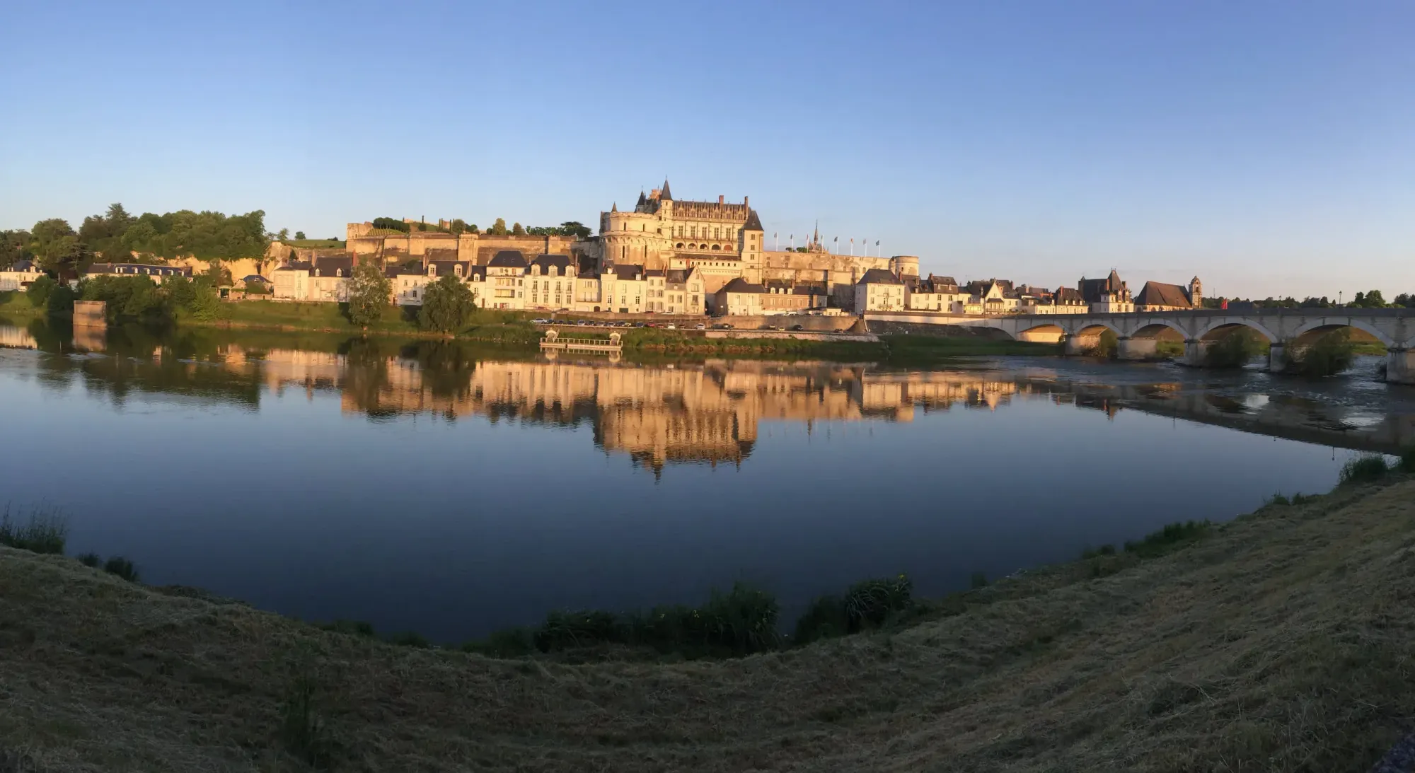 Castle and bridge reflected in river at Amboise