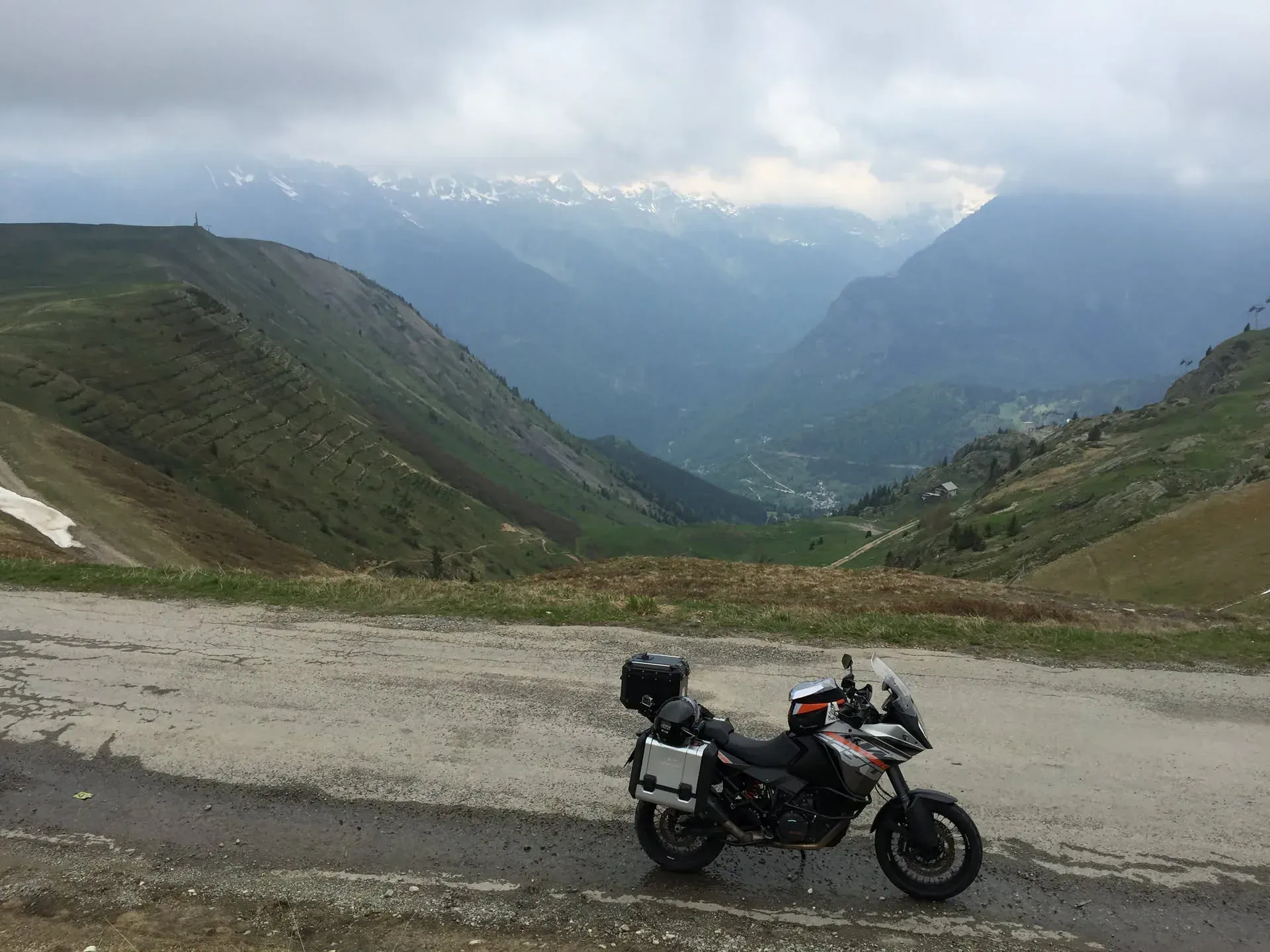 Adventure motorcycle parked in Huez valley