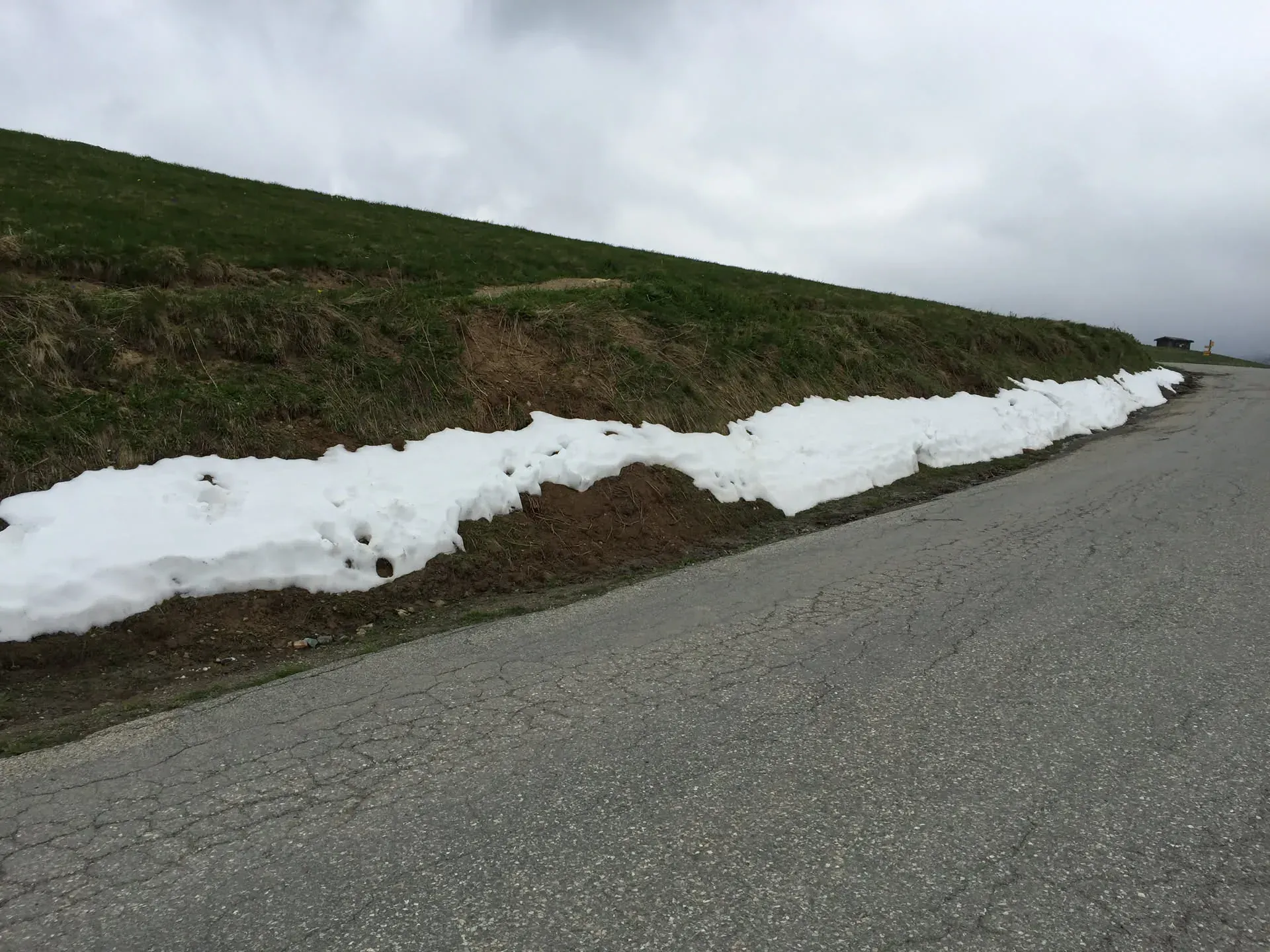 Snow patches along mountain road at L'Alpe d'Huez