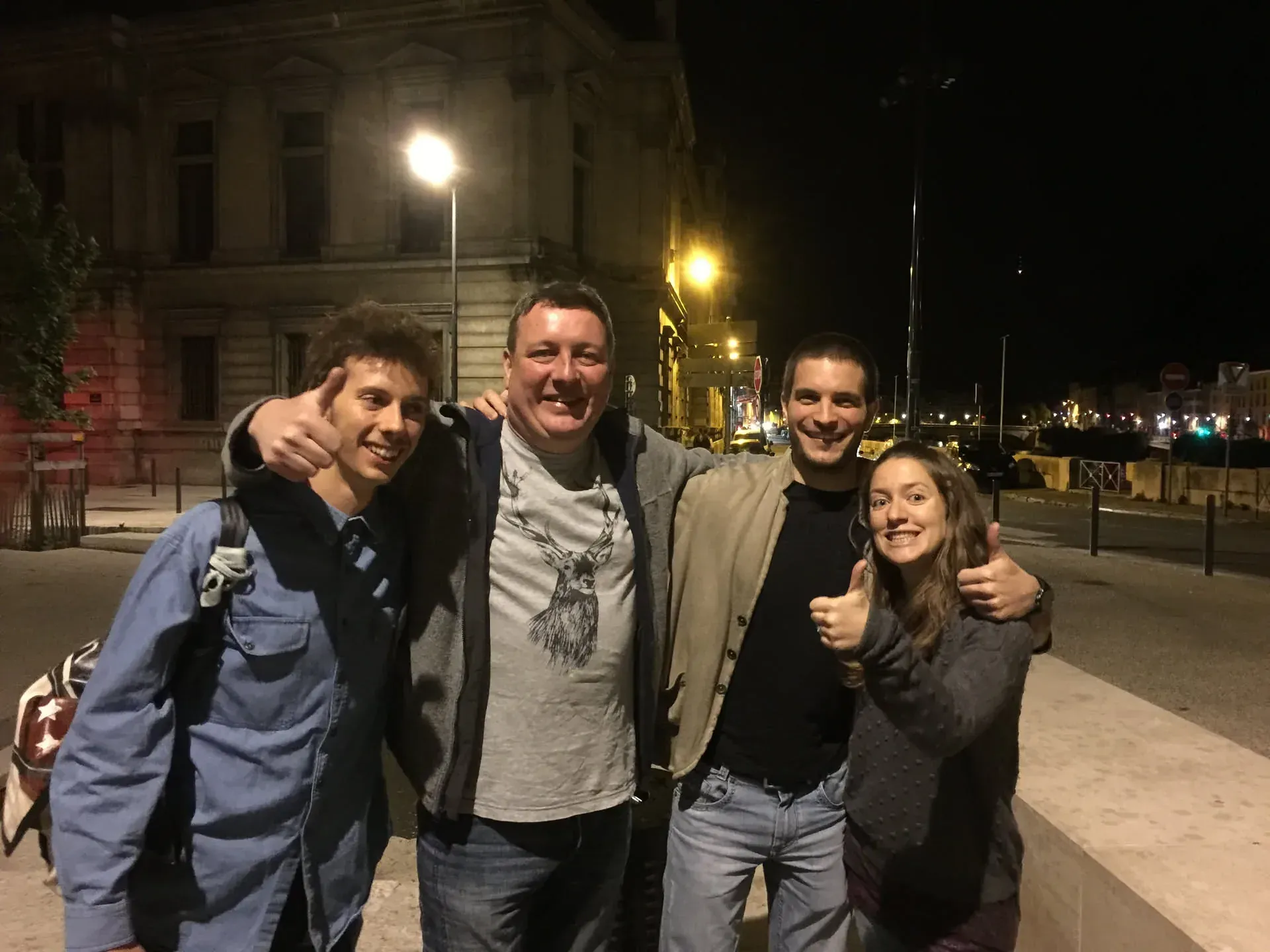 Four people posing at night in Secteur 2, Auvergne-Rhône-Alpes
