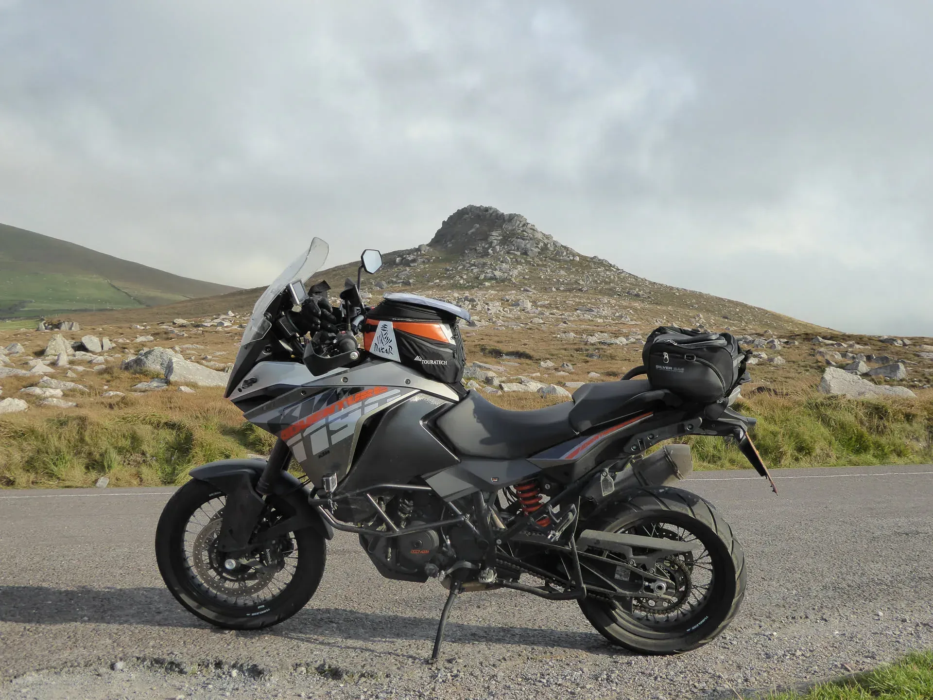 Adventure motorcycle parked on mountain road, Ireland