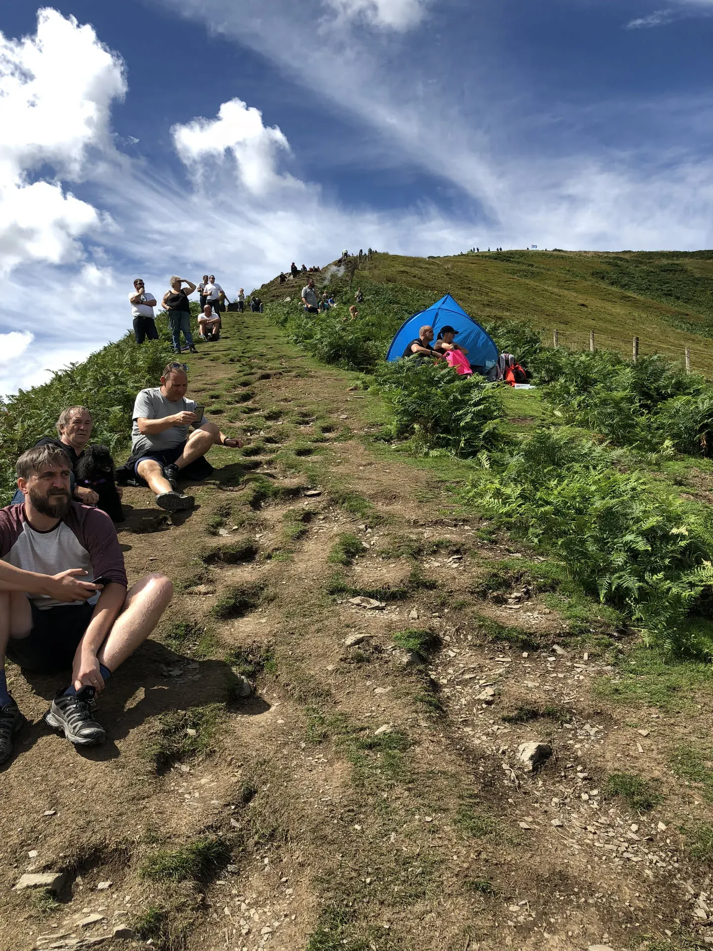 Hikers resting on hillside near Dolgellau, Wales