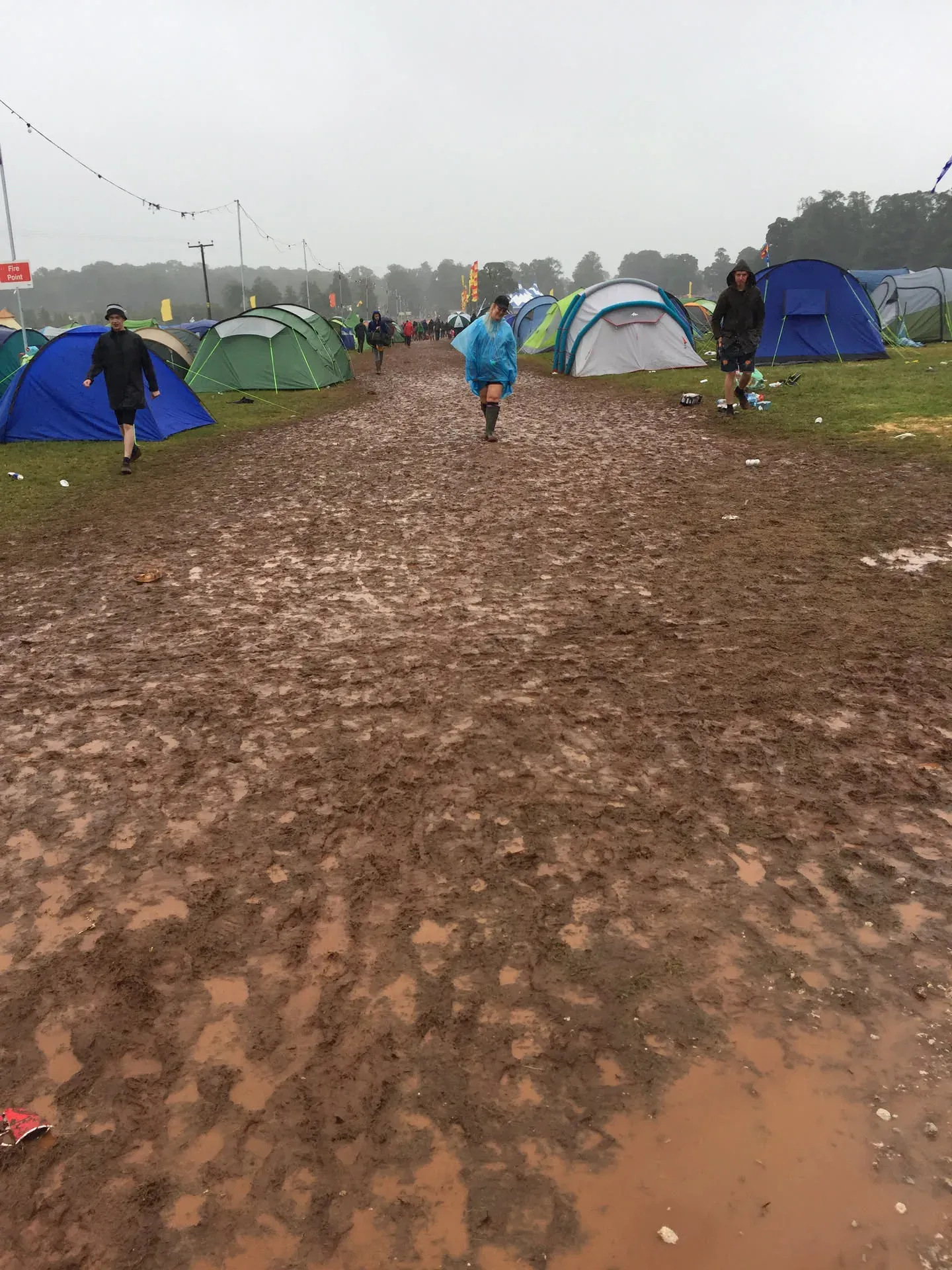 Muddy festival campground in Westmorland with tents