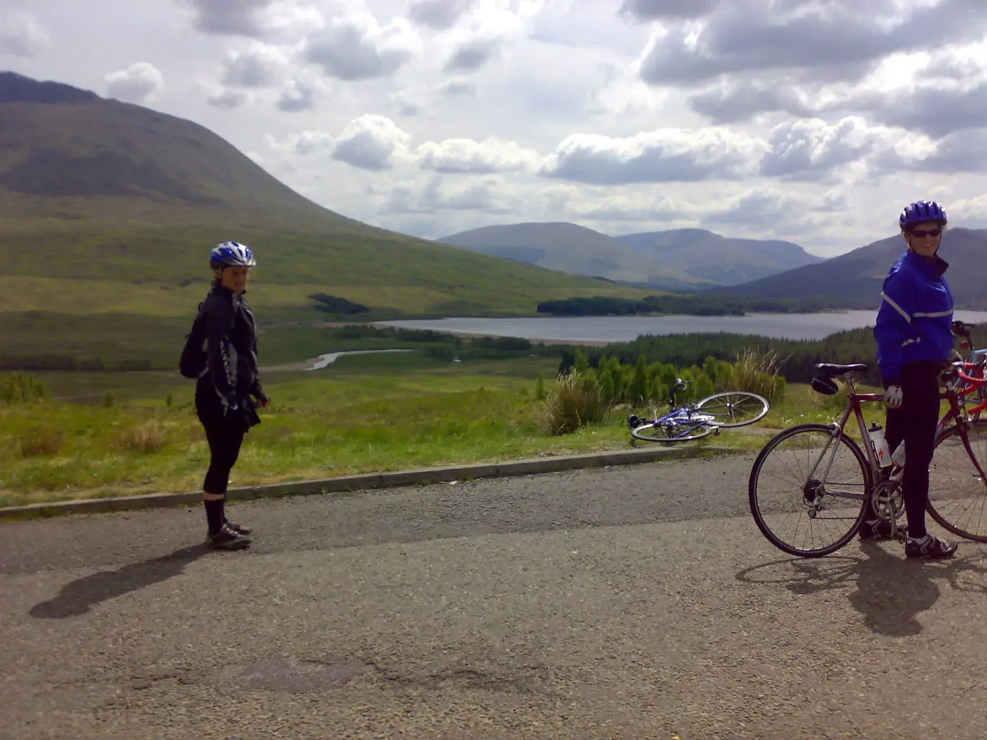 Cyclists taking a break in Scottish Highlands valley