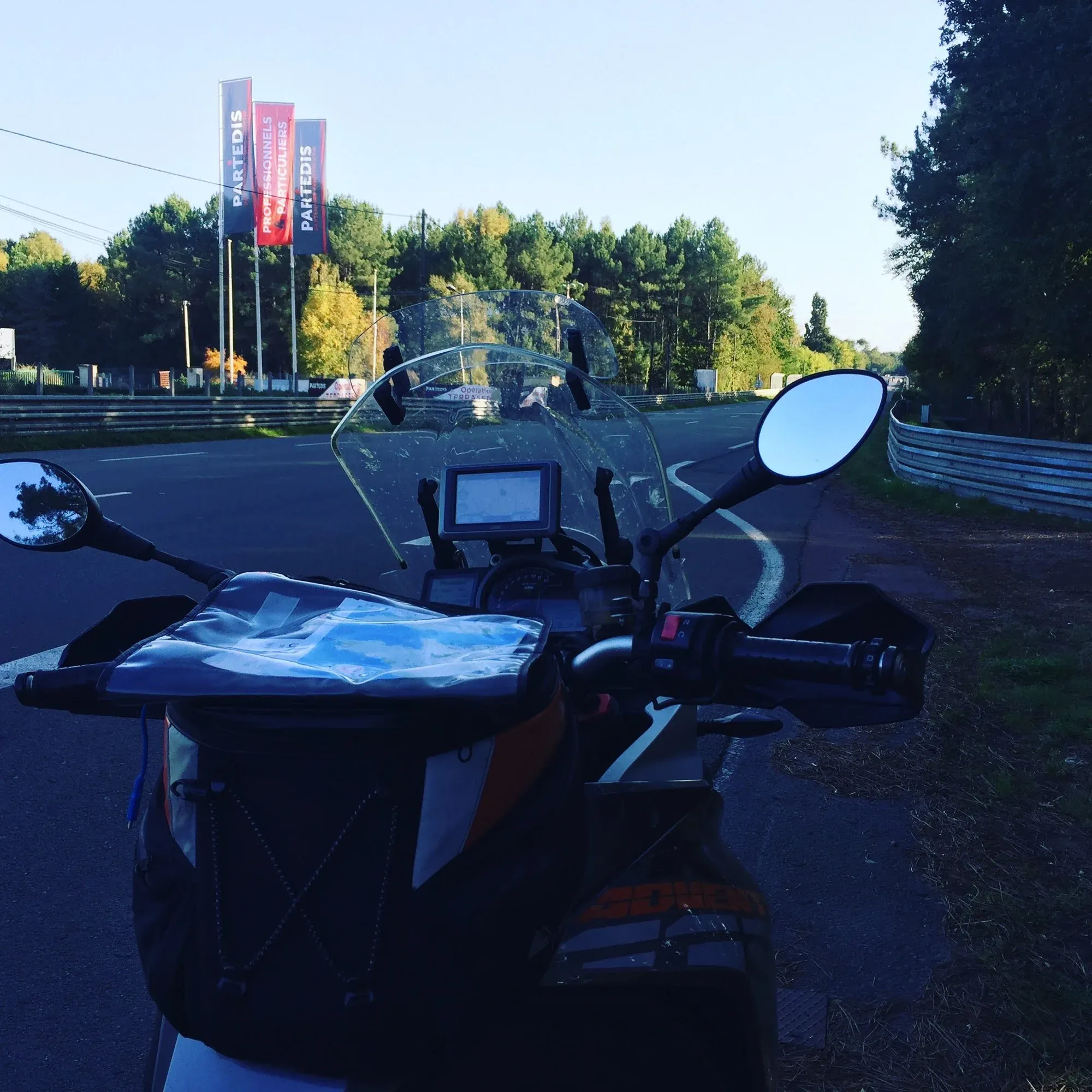Motorcycle dashboard view at Le Mans circuit, Les Canières