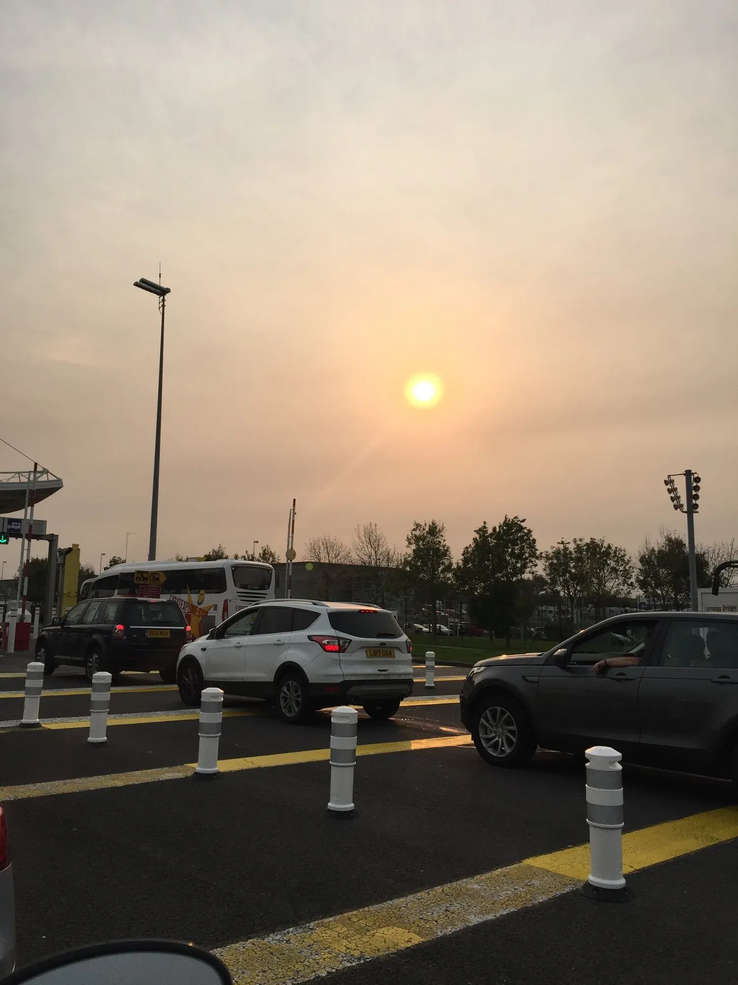 Sunset over parking lot at Coquelles ferry terminal