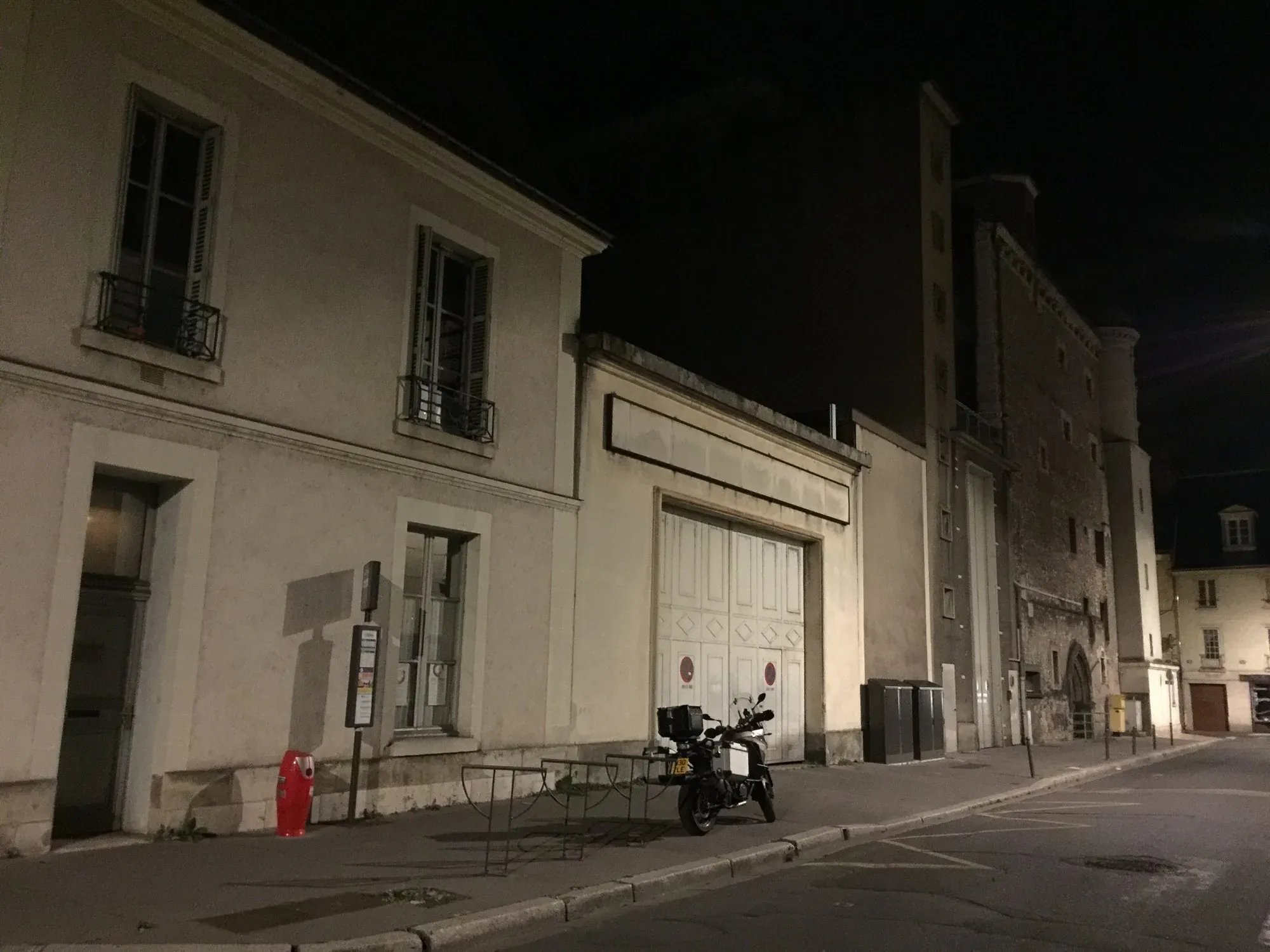 Motorcycle parked on Tours Centre street at night