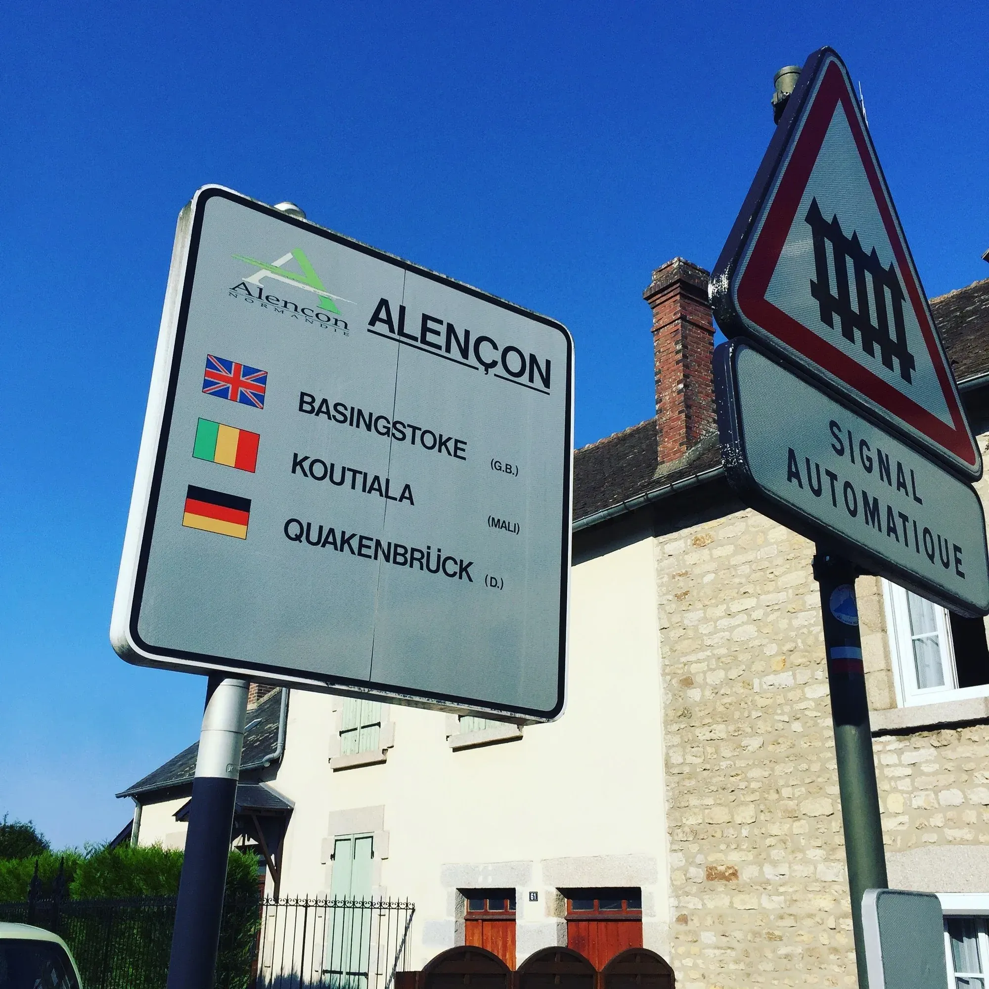 Street sign showing Alençon's sister cities, Normandy