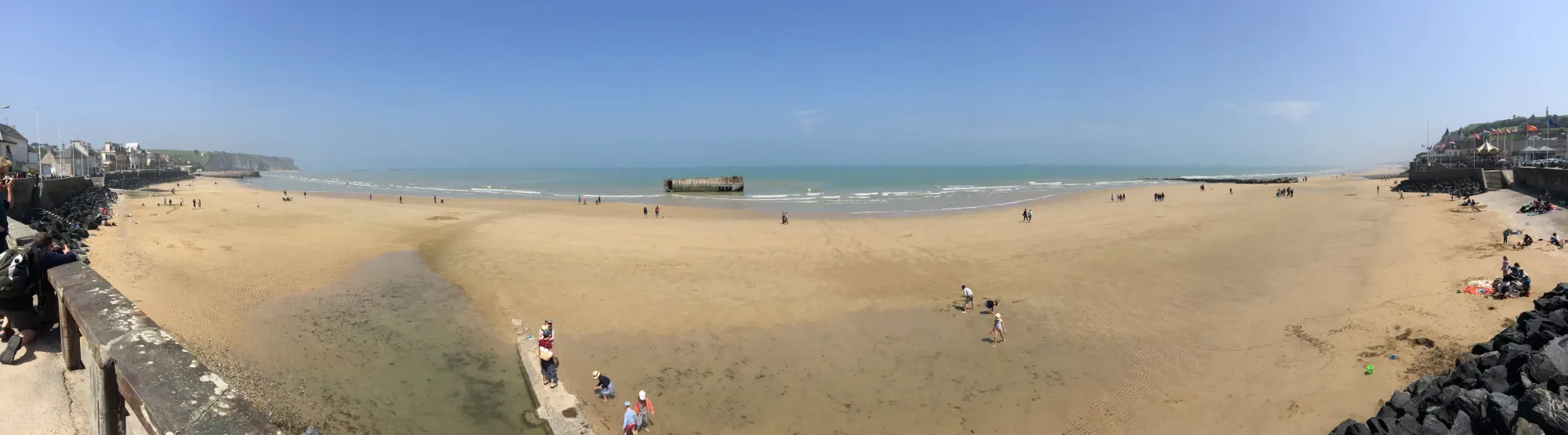 Sandy beach at Résidence with wrecked ship, Normandy