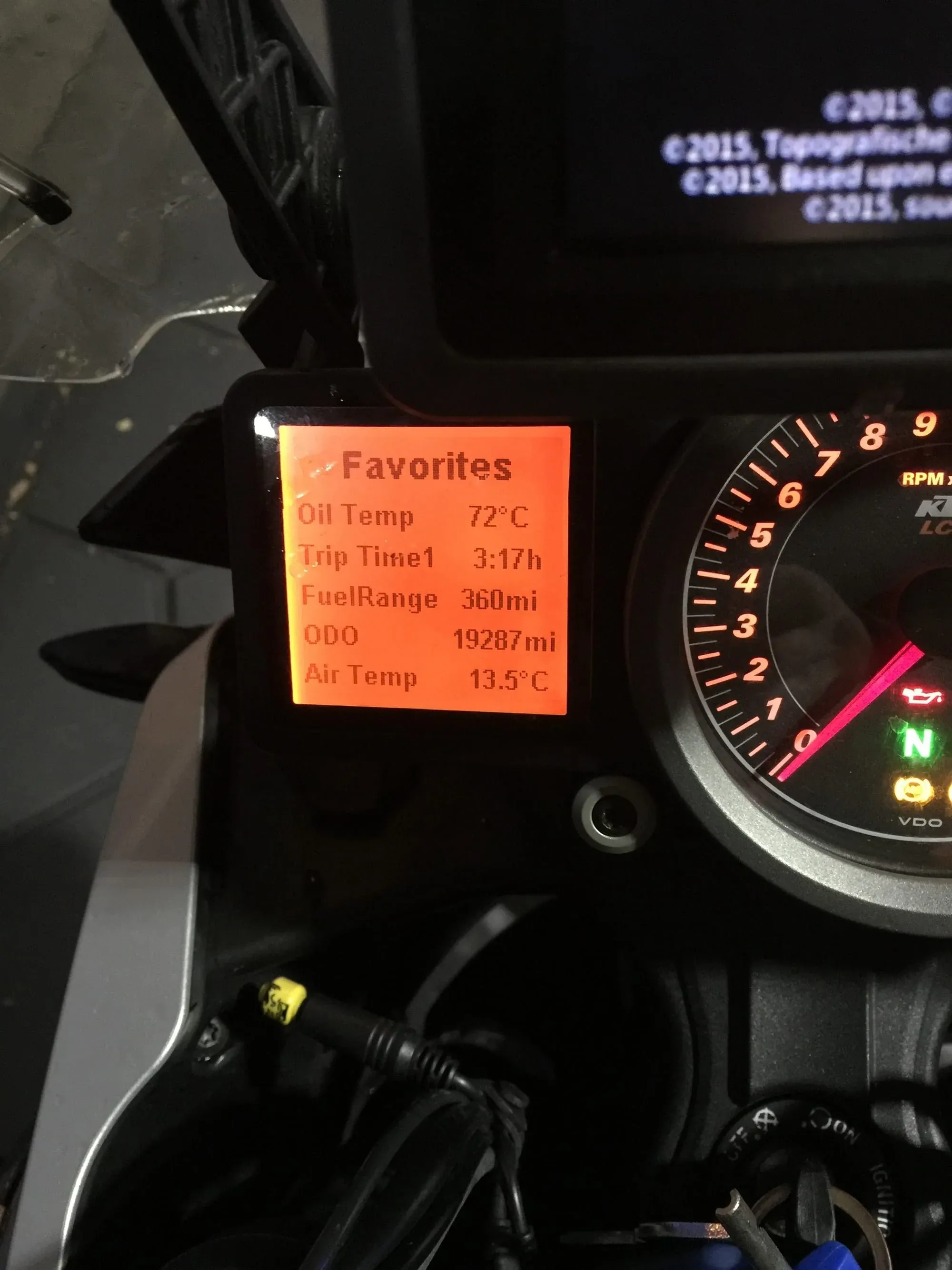 KTM motorcycle dashboard with orange display showing oil temp 72°C, ODO 19287mi