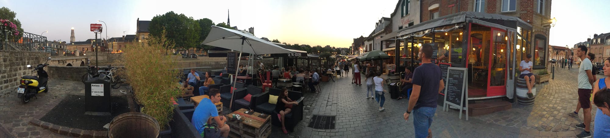 Waterfront café area at dusk in Amiens