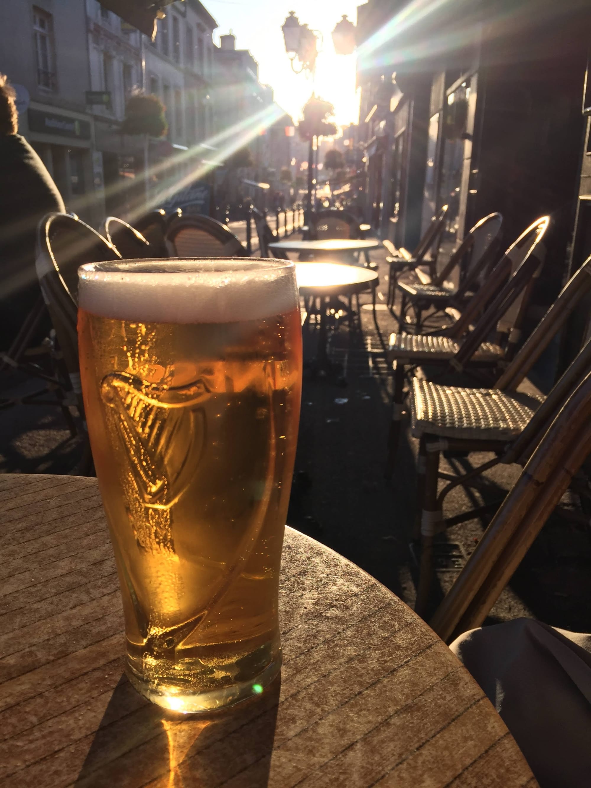 Pint of beer at sunset, Bayeux street café