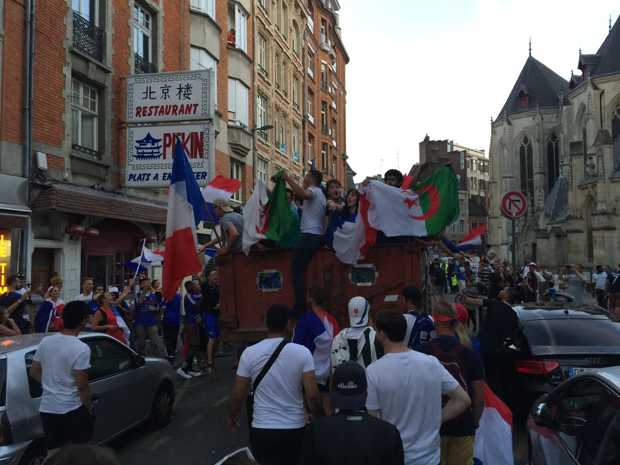 Crowd celebrating with French and Algerian flags, Lille-Centre