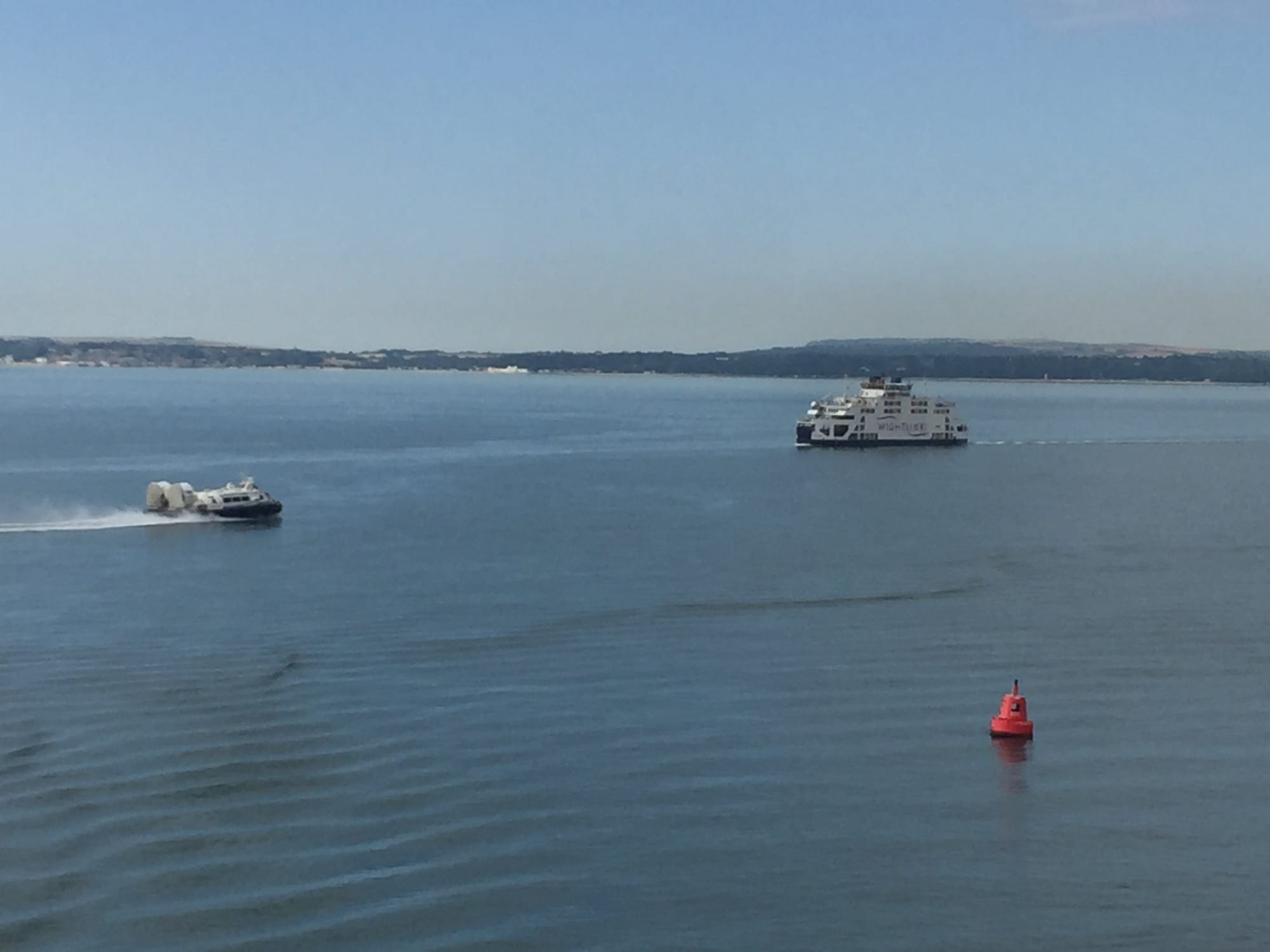 Ferries and red buoy in Old Portsmouth harbor