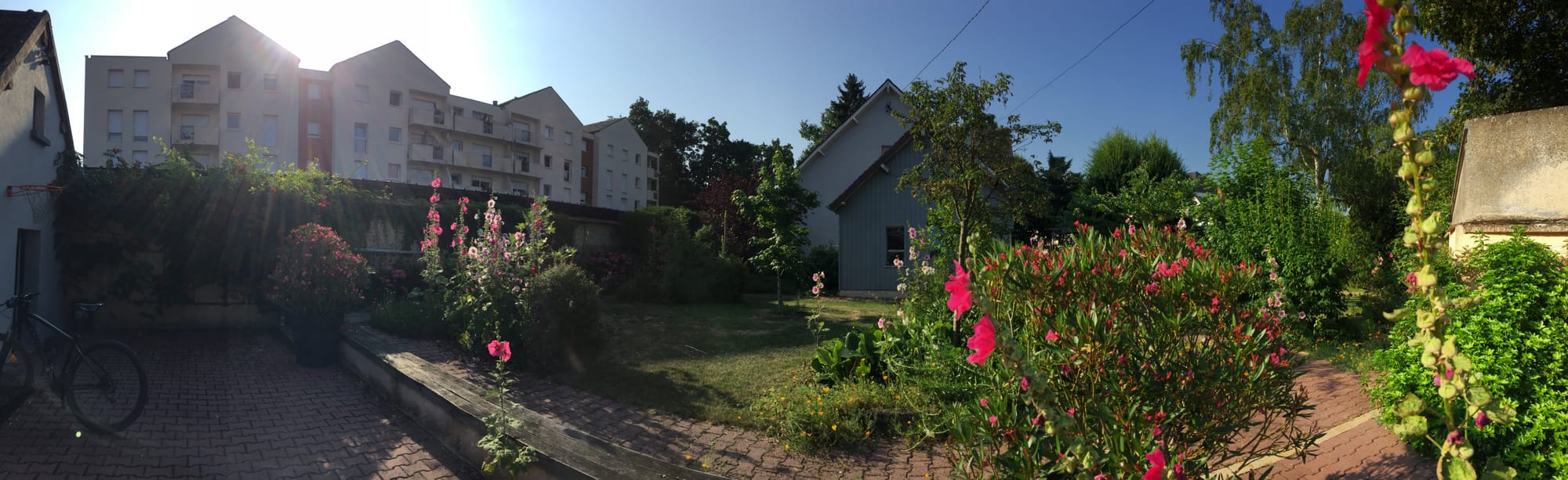 Residential garden with blooming flowers, Côteau d'Aboville